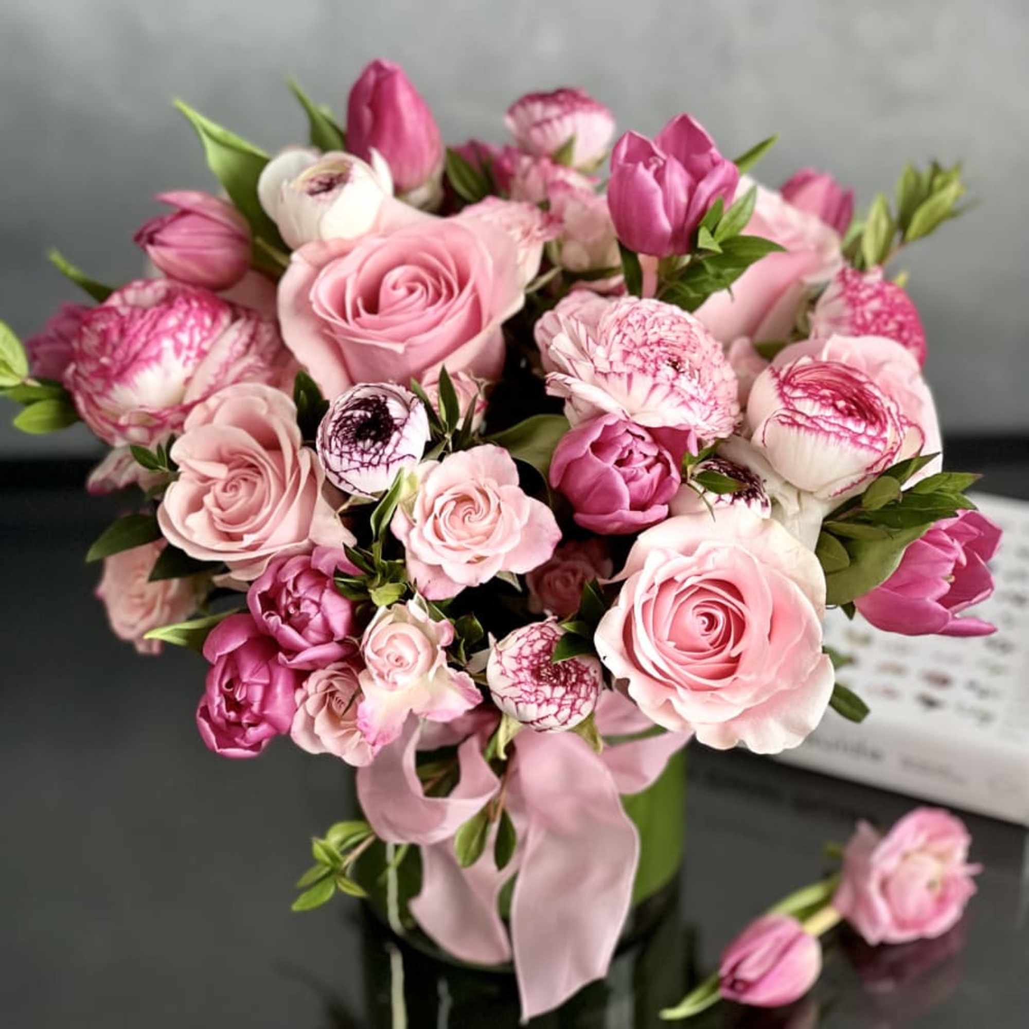 A stunning blend of pinks, creams, and touches of greens are combined