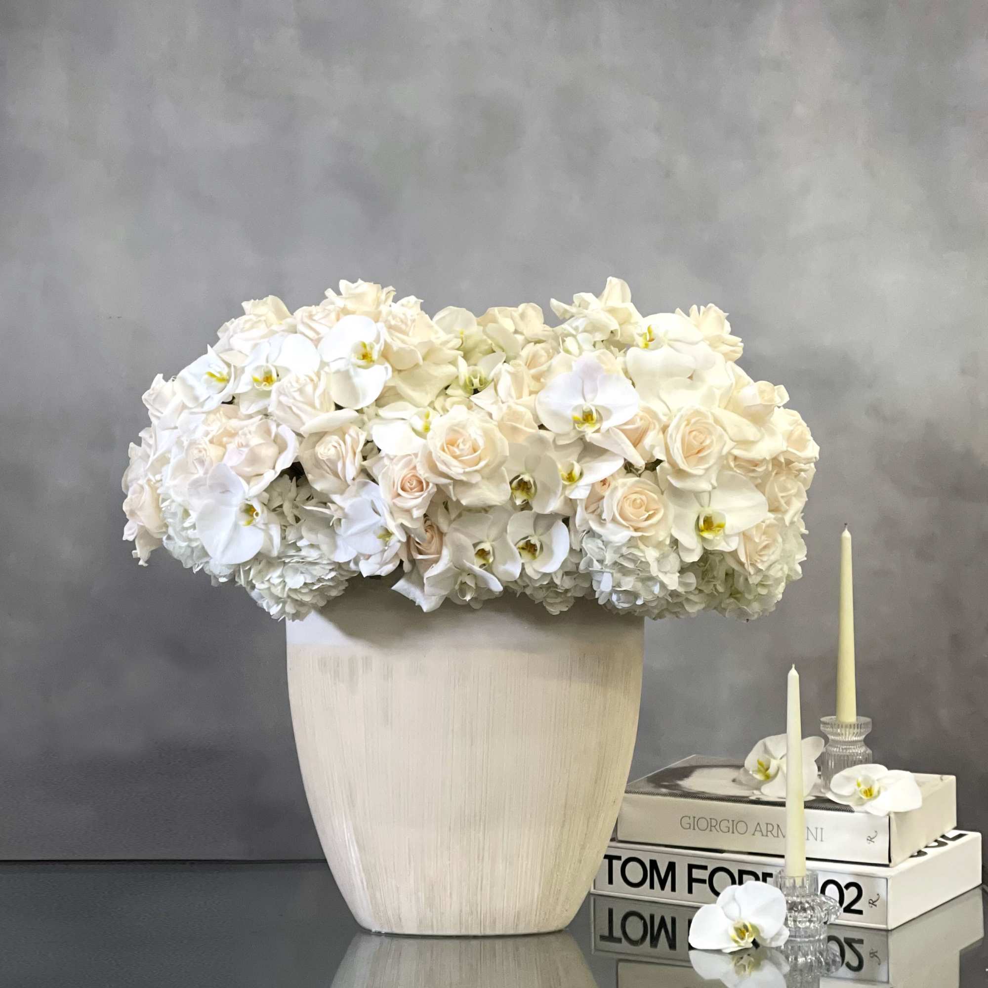 Beverly Hills Florist presents these stunning, over 100 specialty white Ecuadorian, orchids