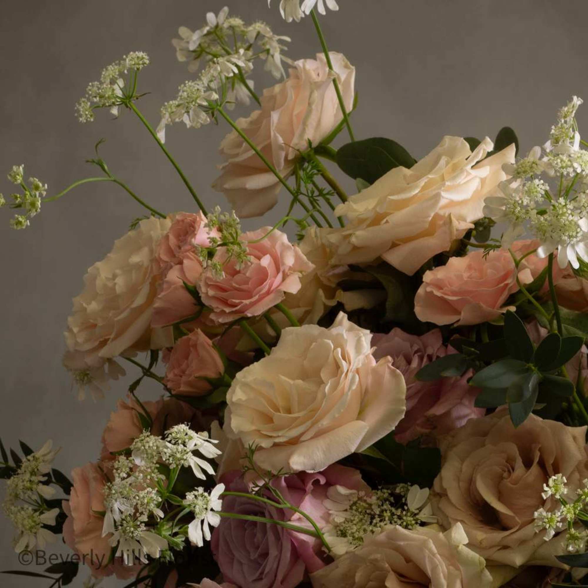 This stunning arrangement boasts over 100 blooms of gorgeous delicate florals, including