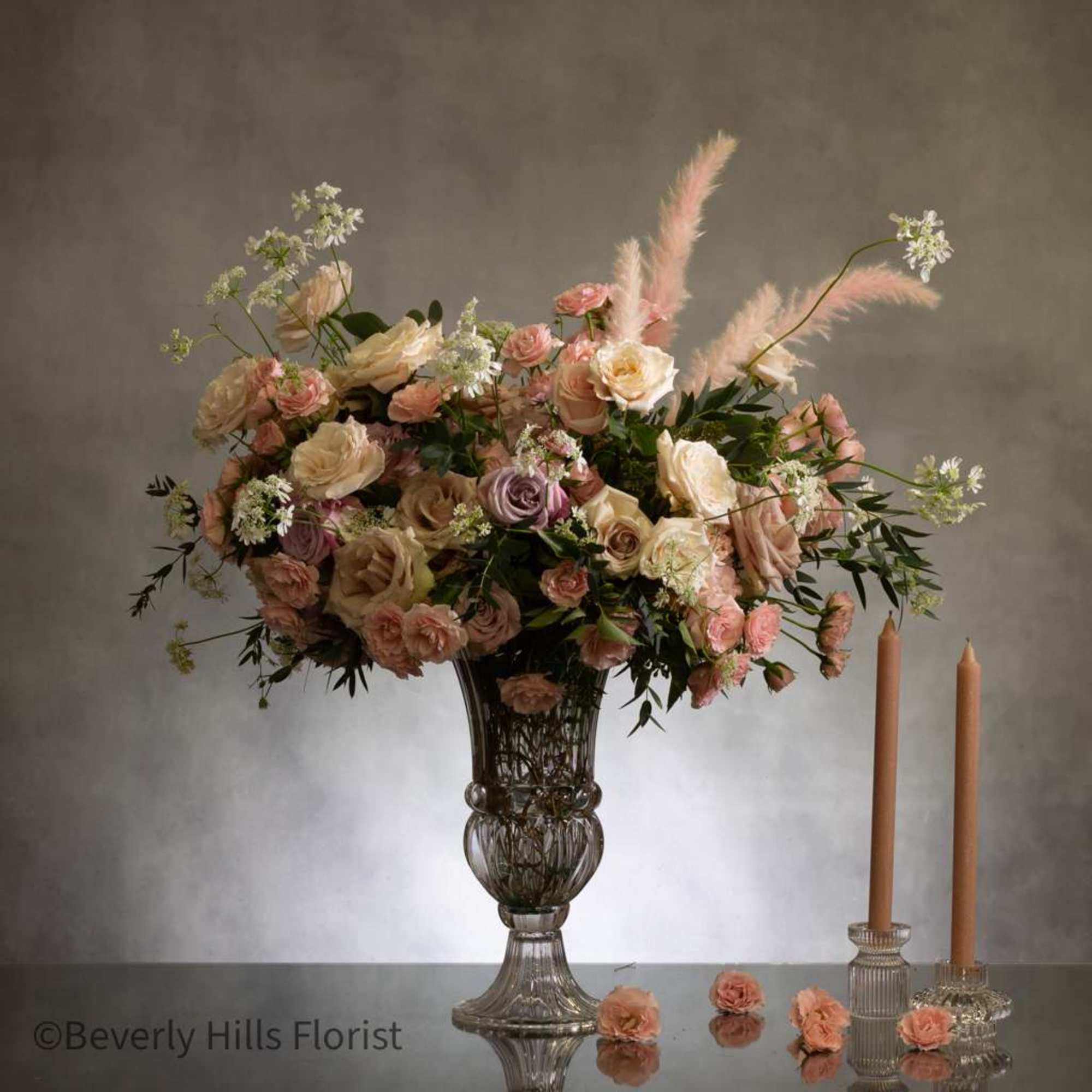 This stunning arrangement boasts over 100 blooms of gorgeous delicate florals, including
