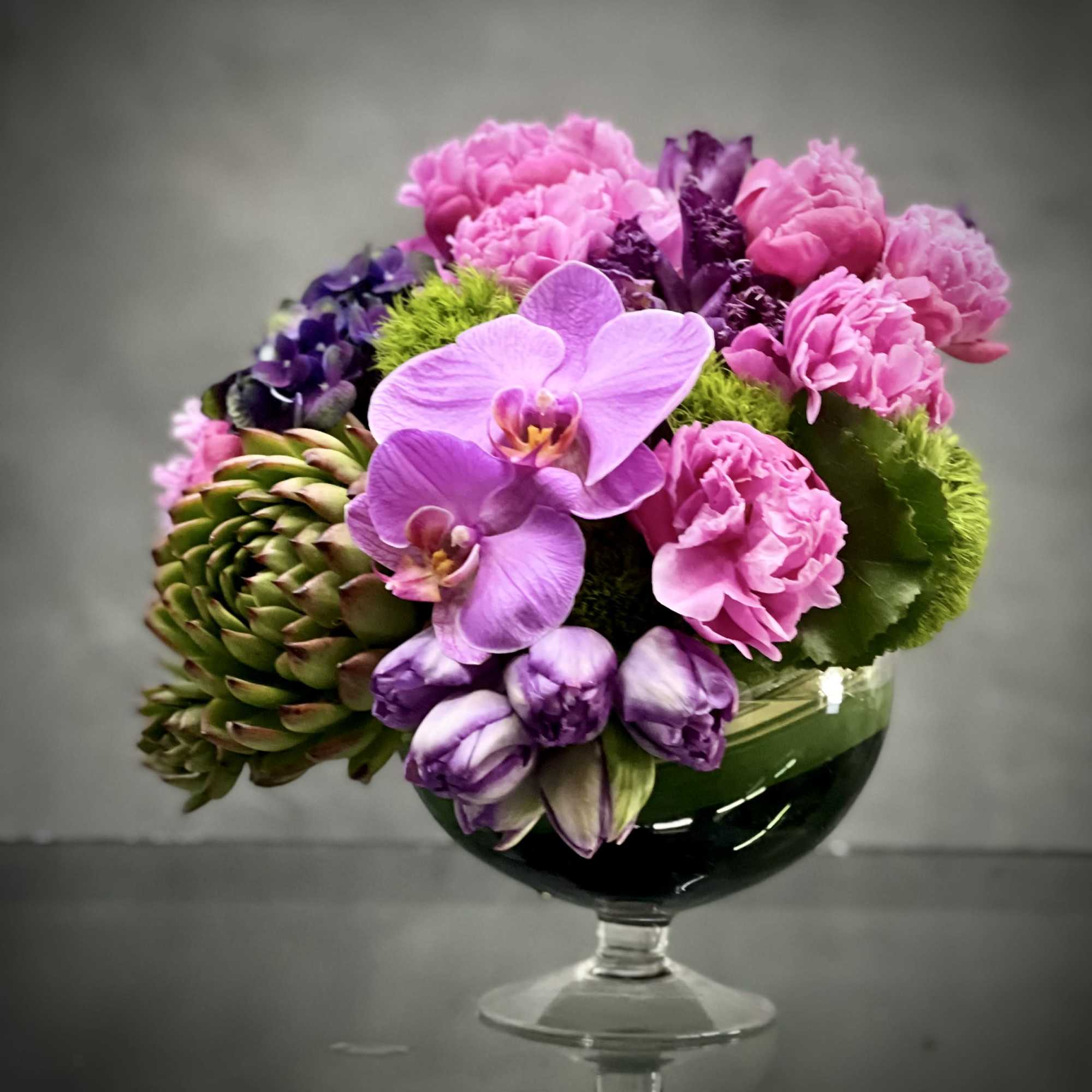 This striking floral arrangement designed by one of our talented designers consists