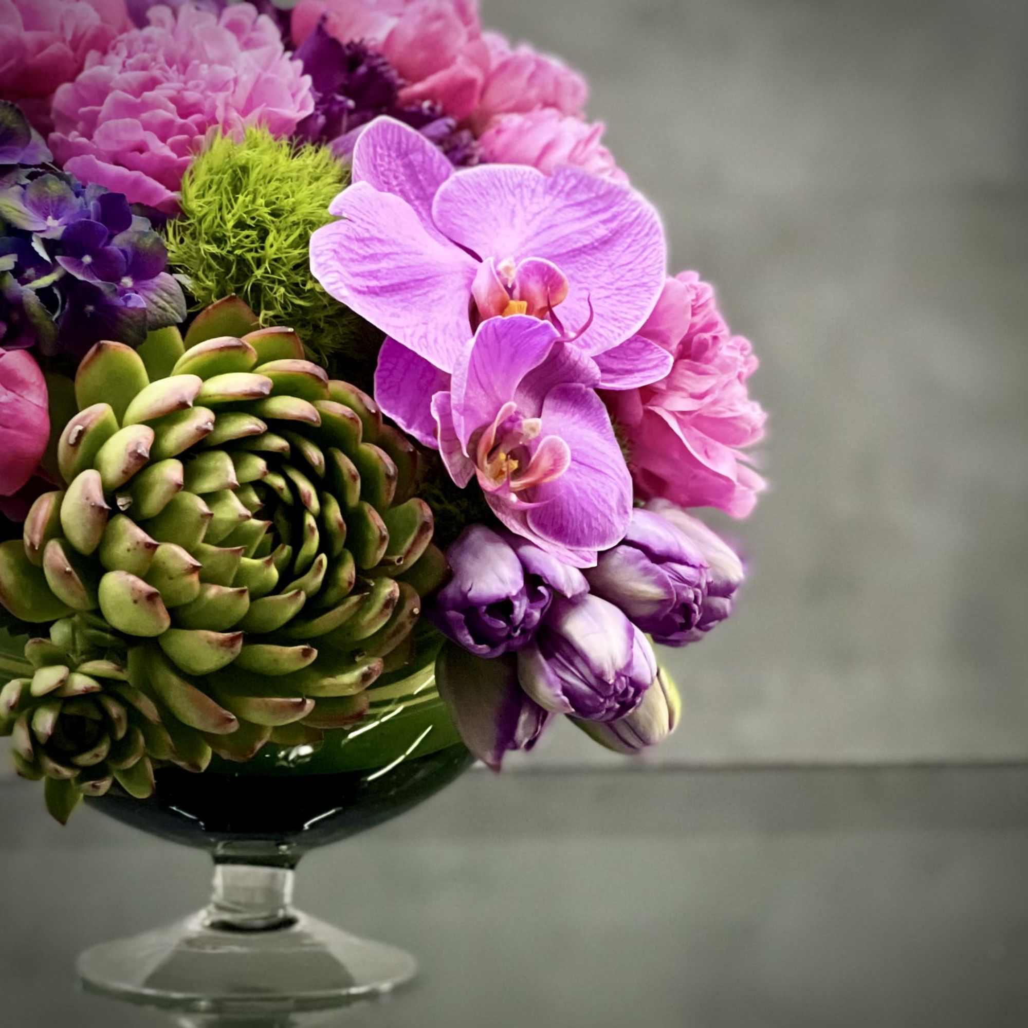 This striking floral arrangement designed by one of our talented designers consists