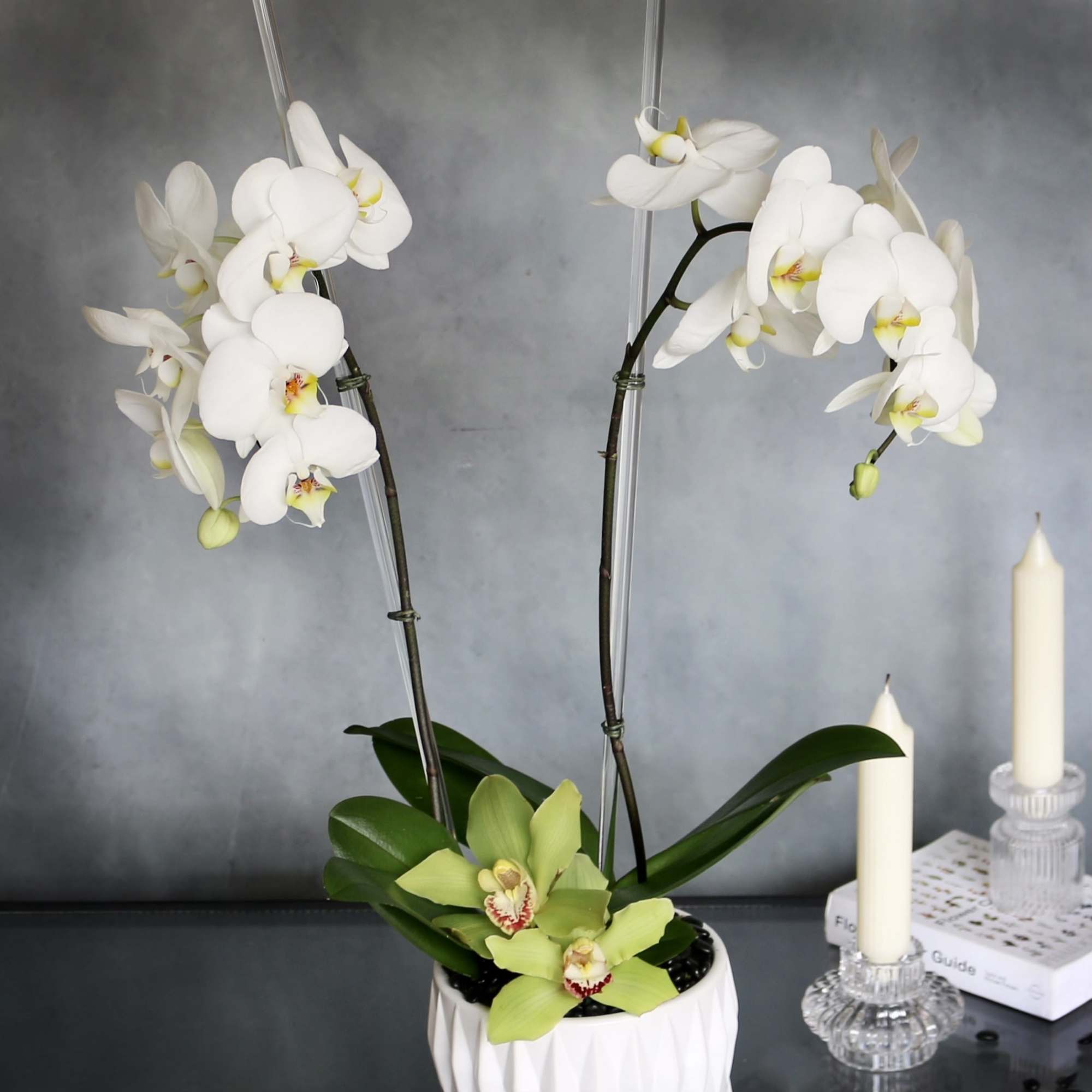 Our Orchid piece consists of two simple white Orchids accented with green