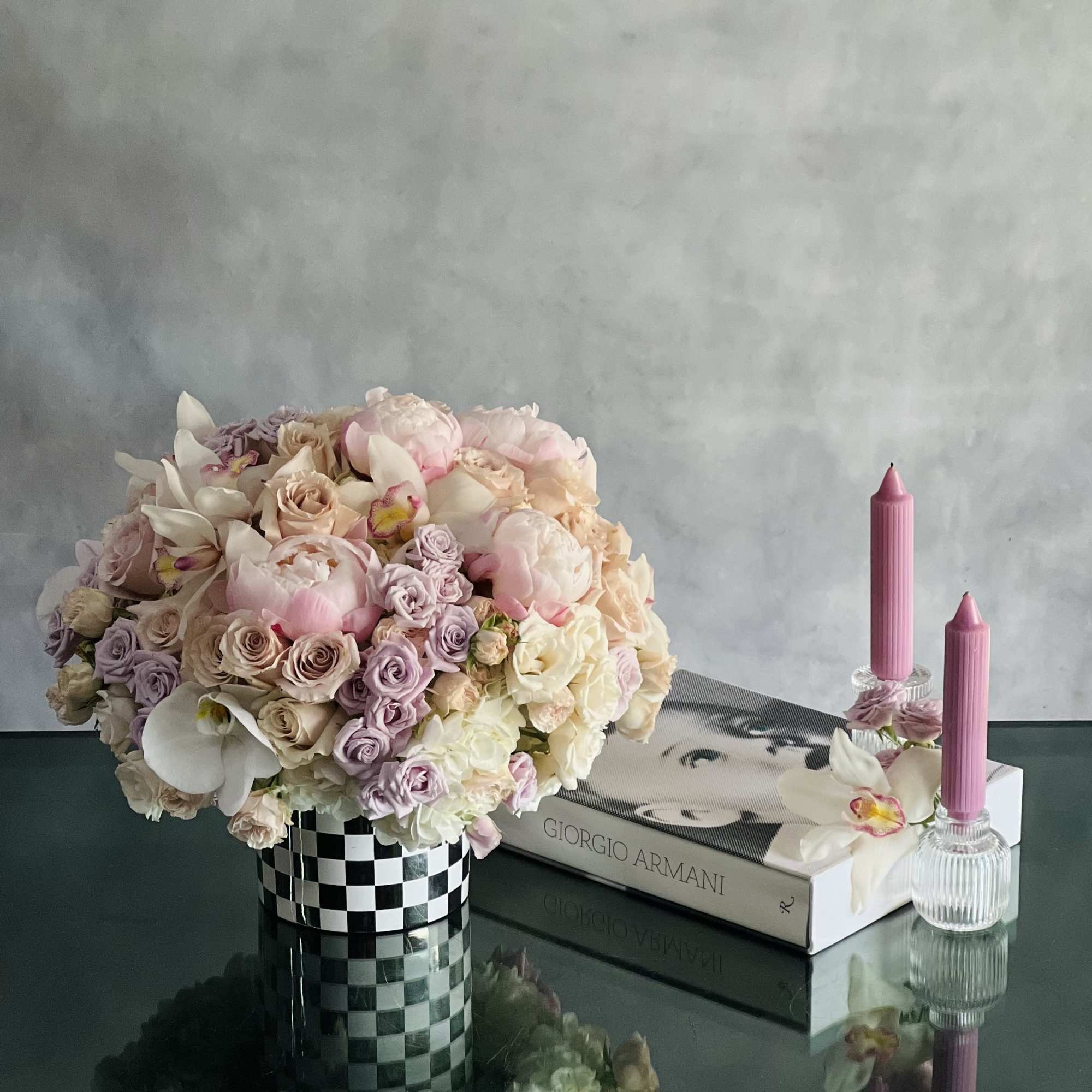 This beautiful array of light pink peonies, pink roses, lavender and light