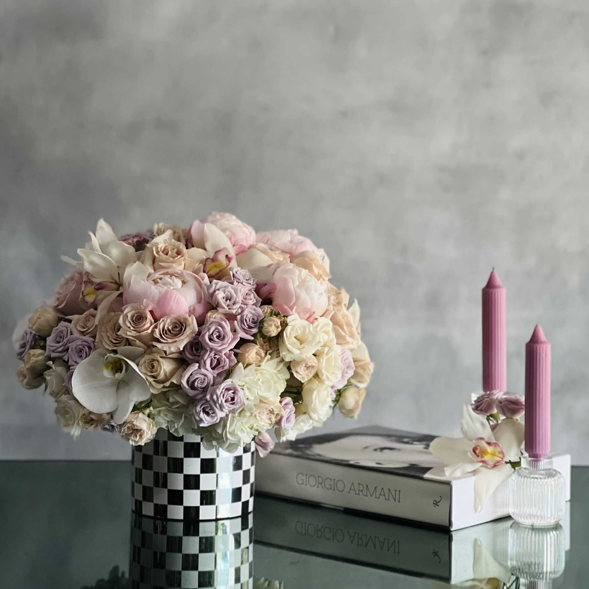 This beautiful array of light pink peonies, pink roses, lavender and light