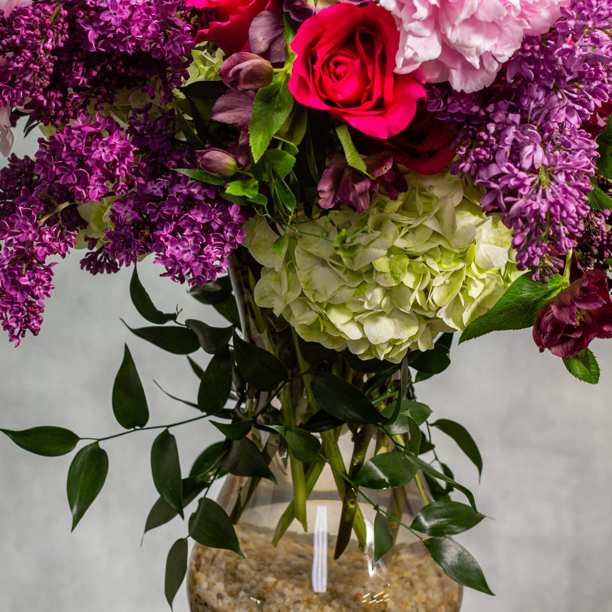 Elevate your surroundings with this opulent floral arrangement that marries the finest