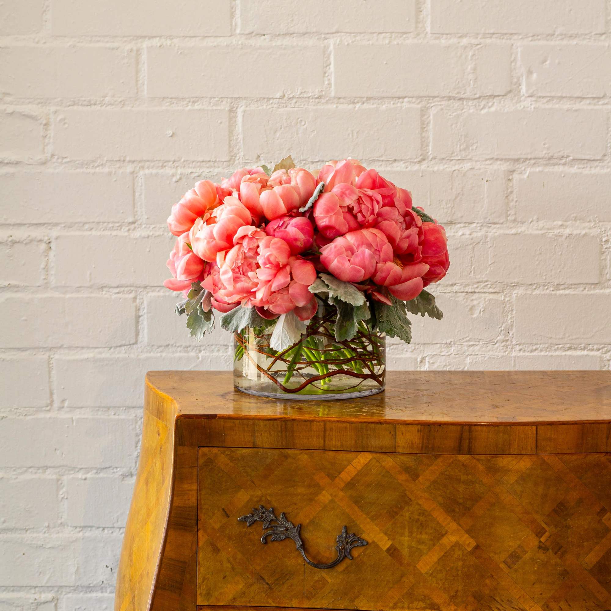 Immerse yourself in a sophisticated floral display featuring coral pink single petal