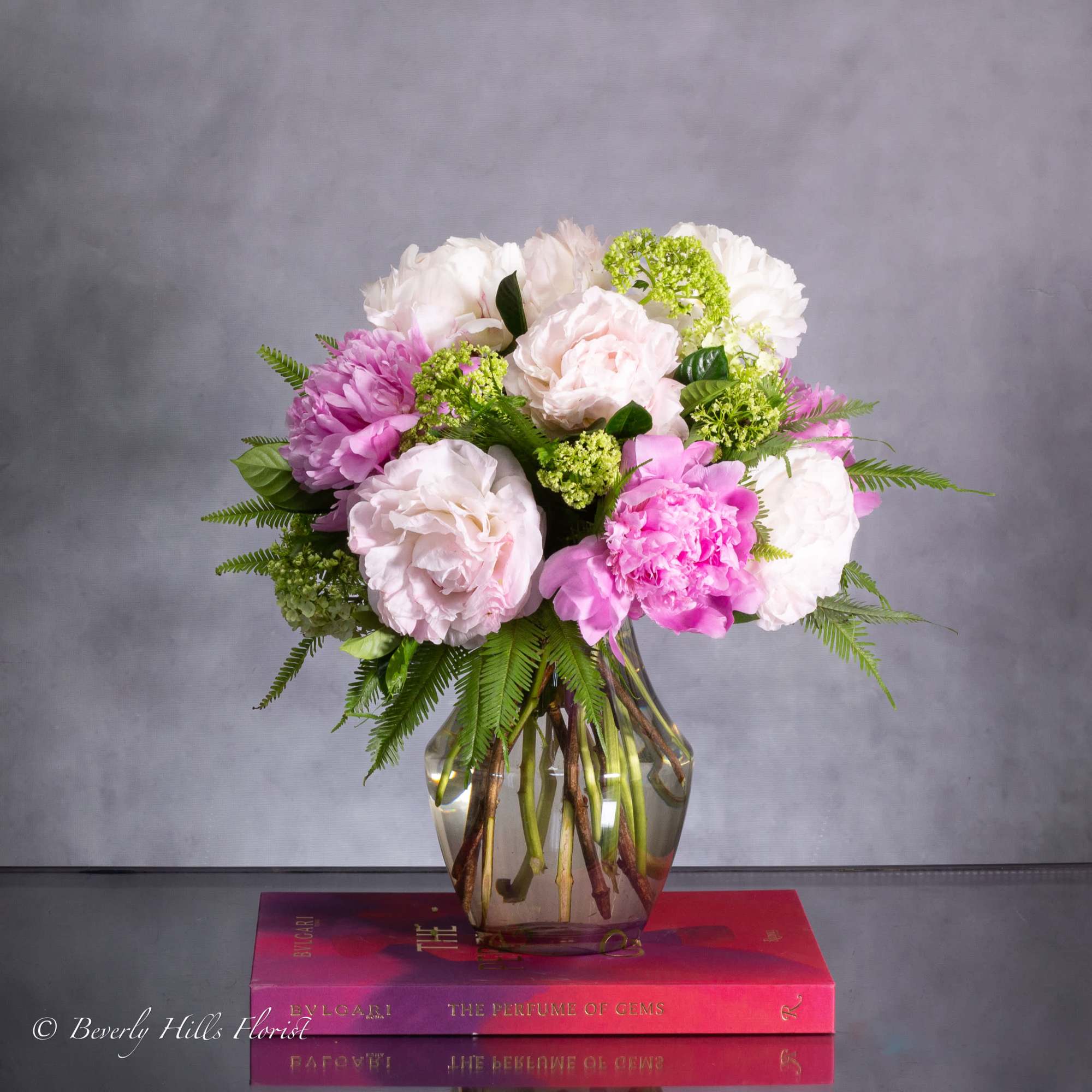 Available for Same-Day Delivery!

Nestled within a sleek vase, the Ethereal Elegance arrangement