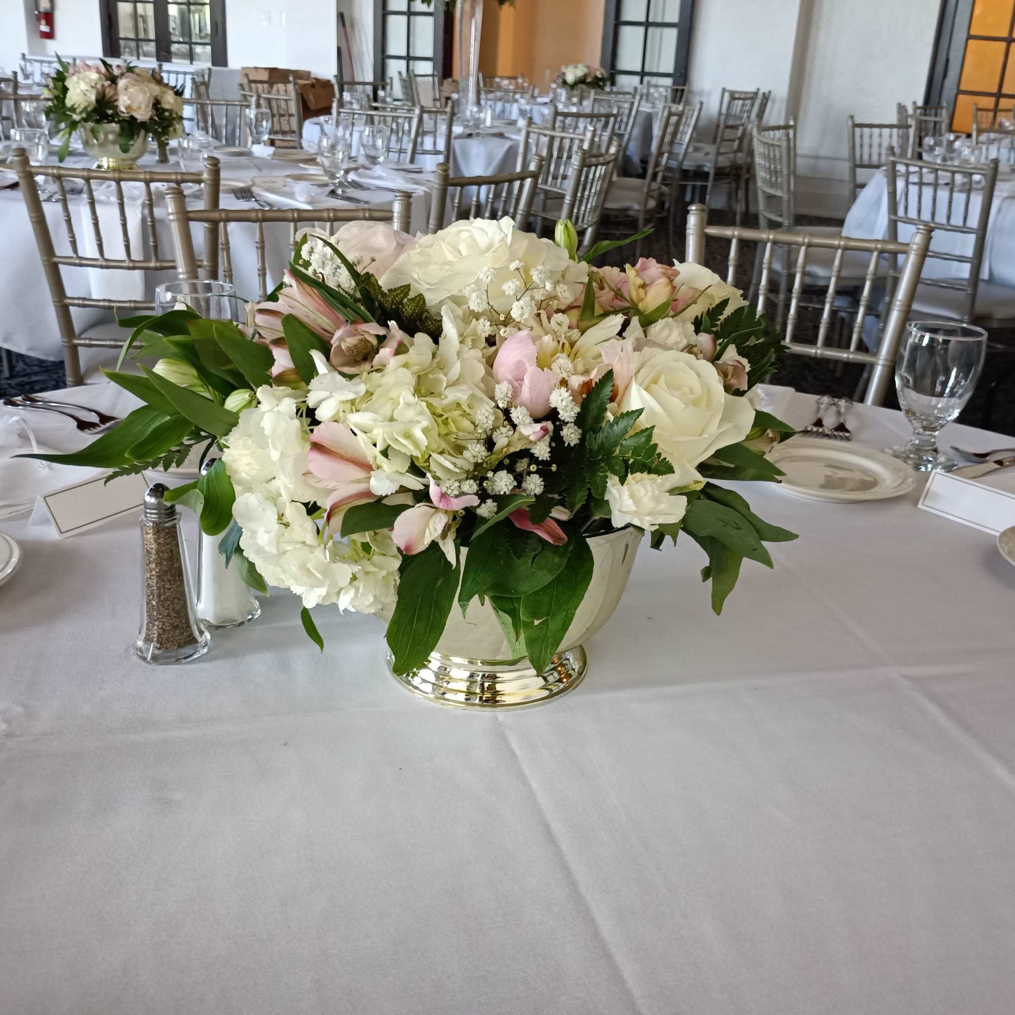 beautiful pastel classical compote shaped plastic gold vase with peonies, roses, alstroemeria