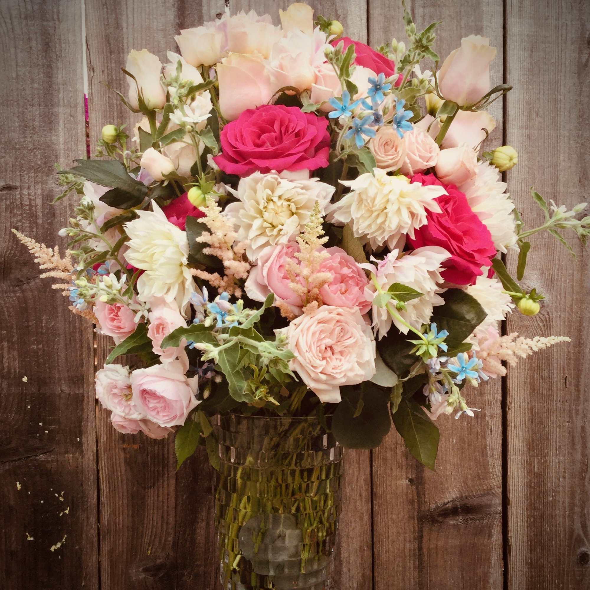 Deep red roses with a white baby breath could express love and