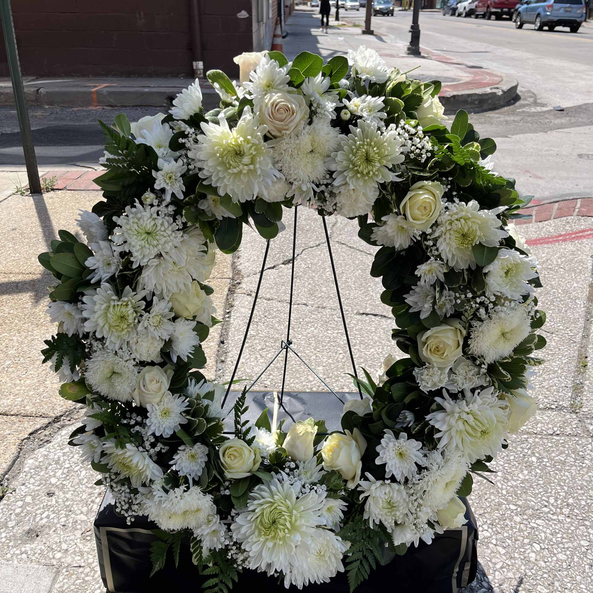 Standing Spray to be displayed beside a casket. White blooms arranged in