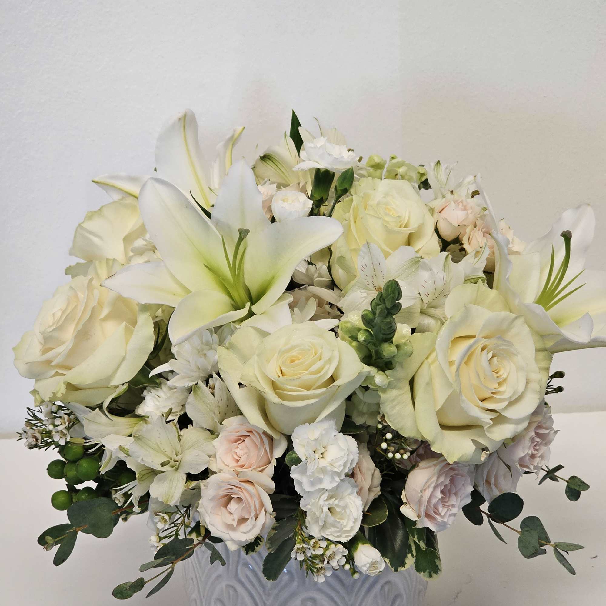 Embrace tranquility with our Beautiful Purple and White Breeze Arrangement, featuring a