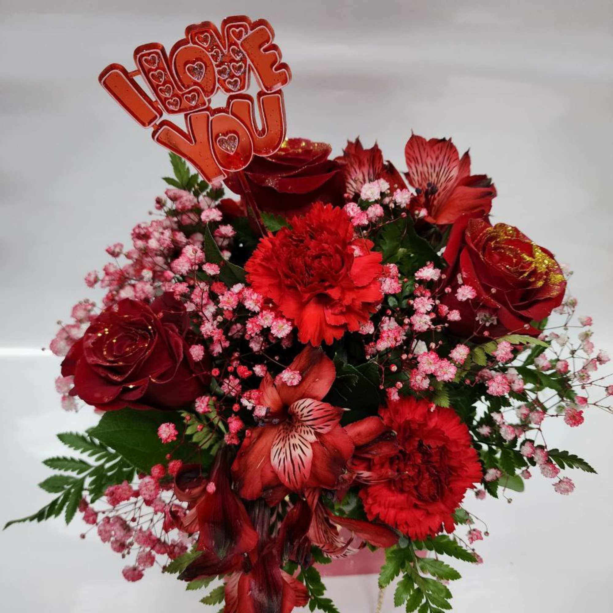 a Bag of a   3 Red Roses  with 