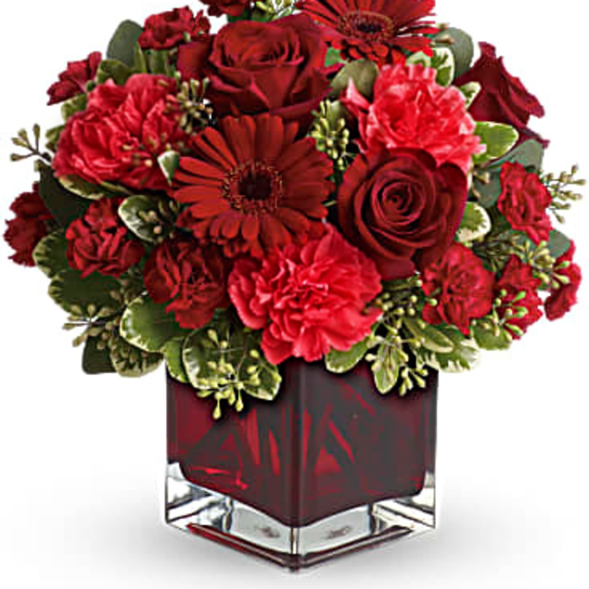 A mix of roses, carnations and more in shades of red accented