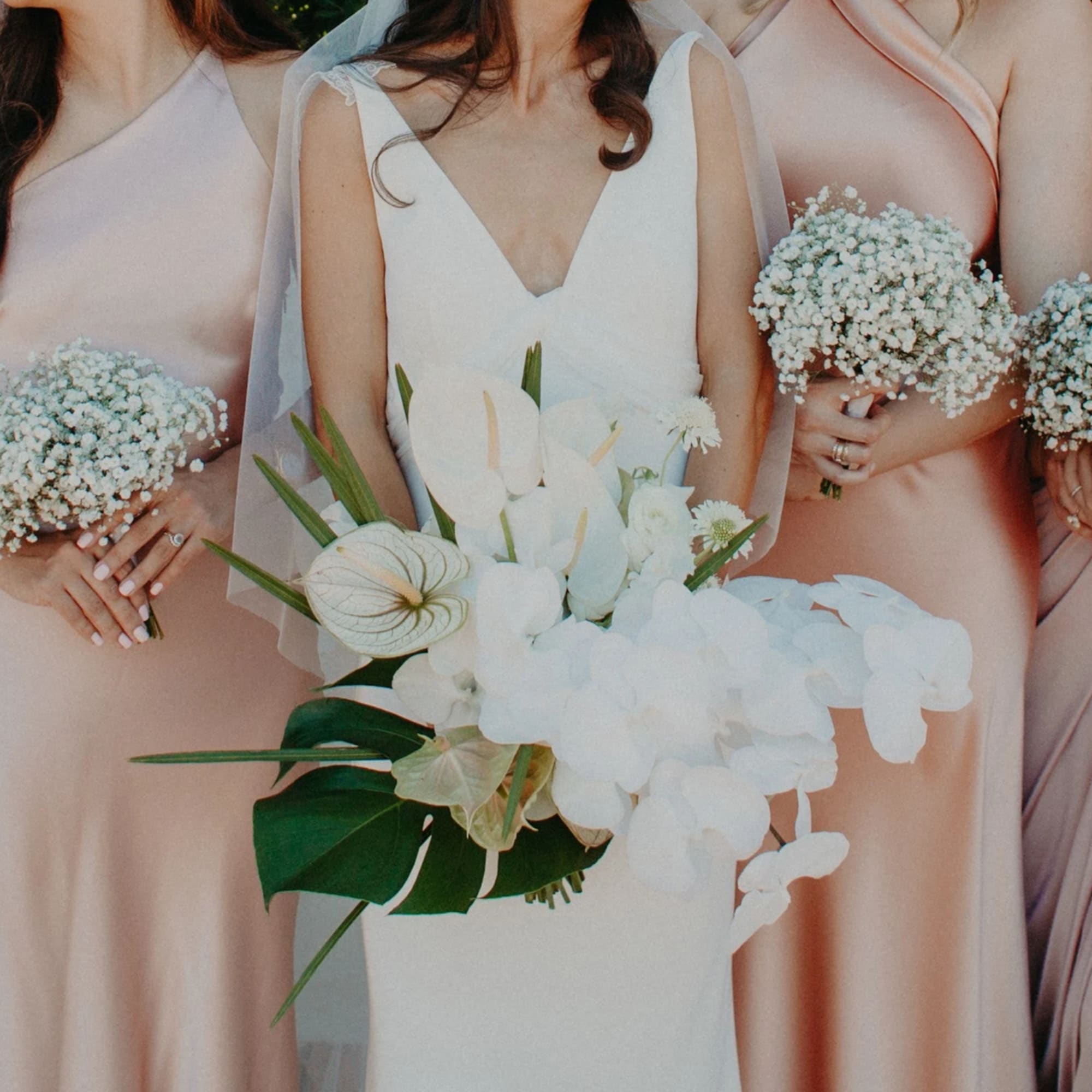 - Stunning bridal bouquet blending crisp whites and lush greens with a