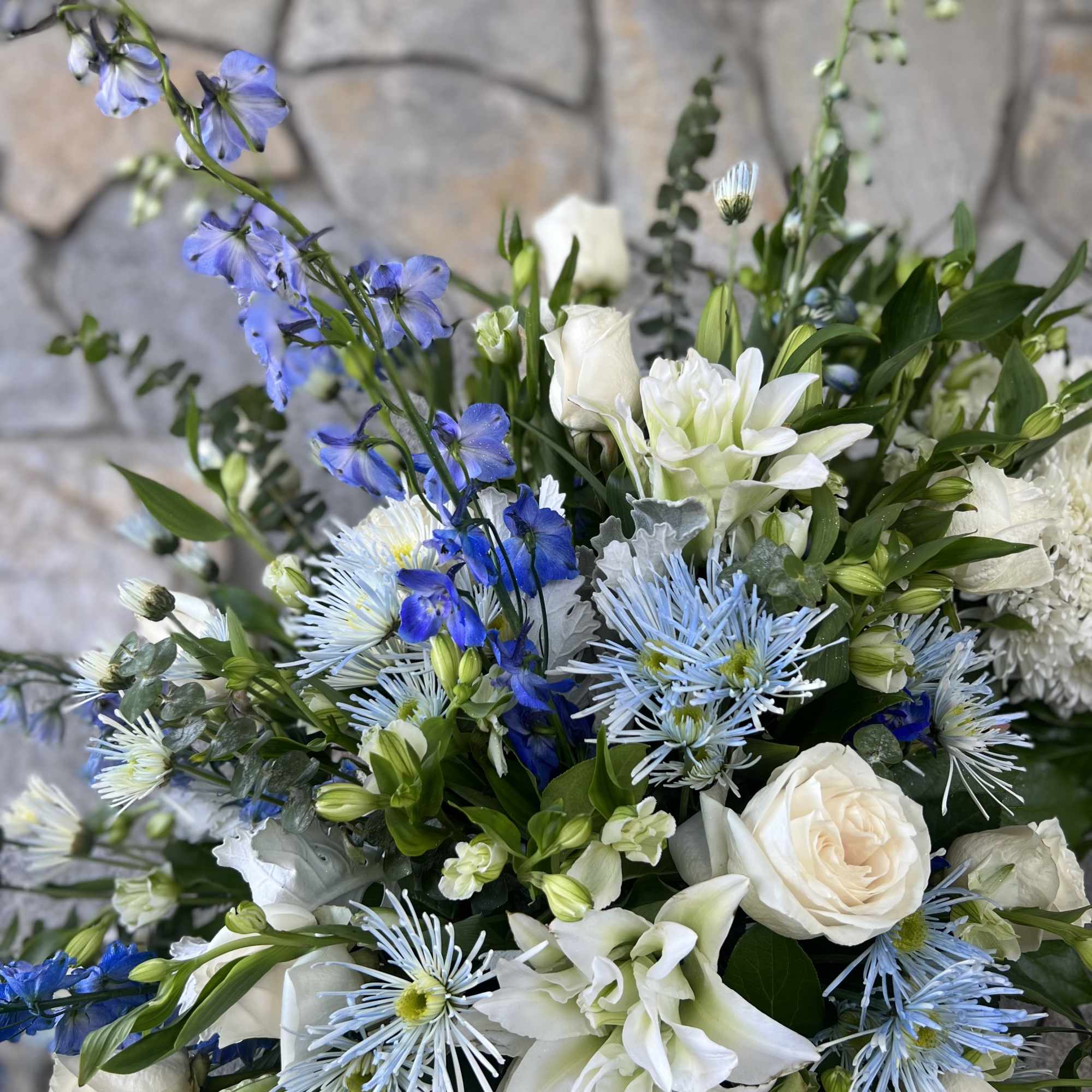 Blue and White Flowers.
30&quot; Approx. Stand and Ribbon.