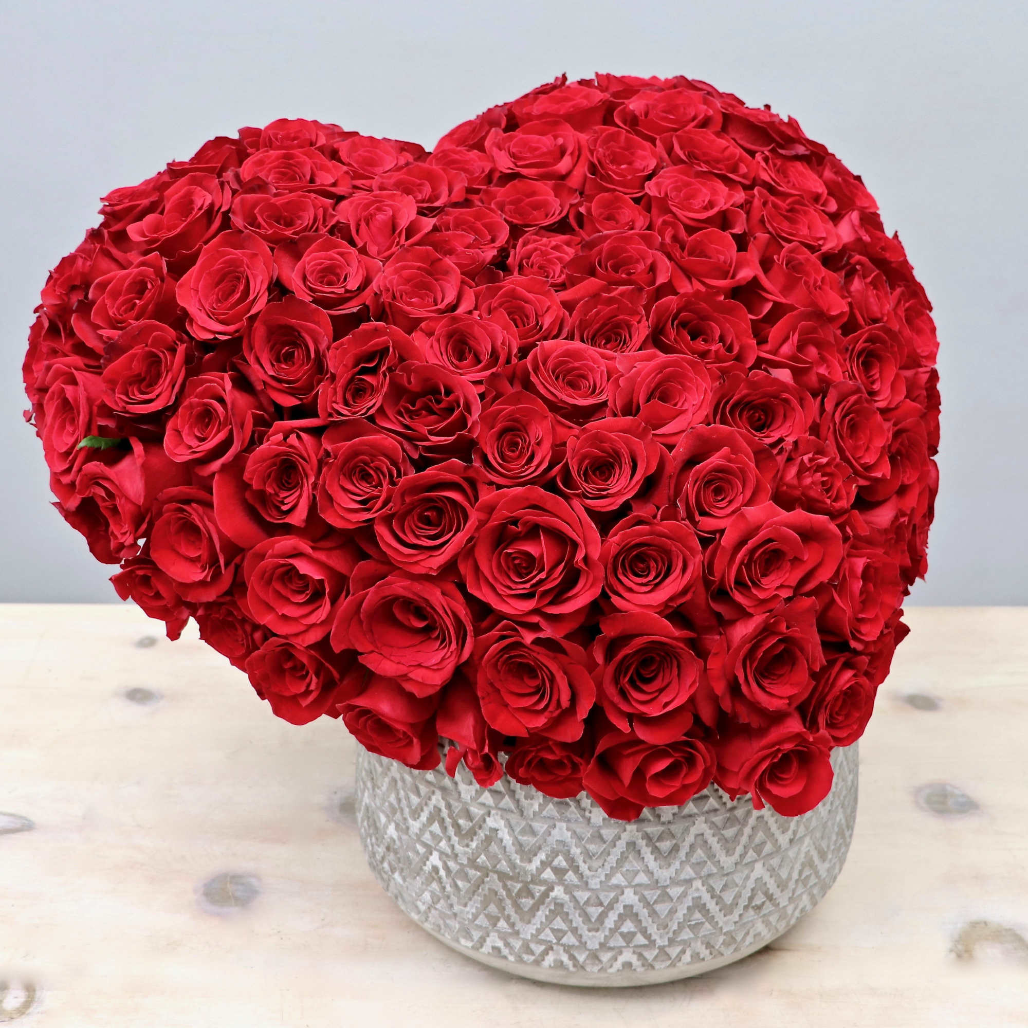 This hand crafted heart arrangement consists of 100 premium red roses. Make