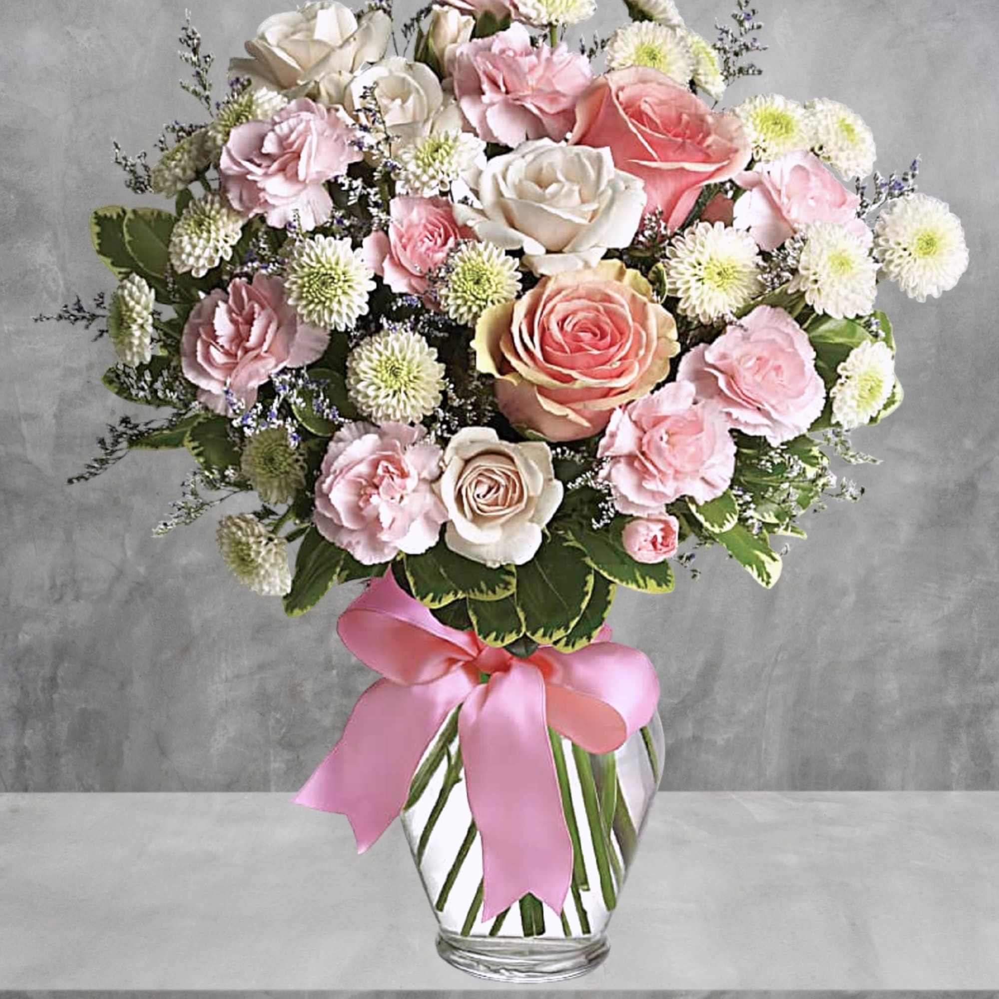 Sweet as candy! This soft pink and white bouquet is a feminine