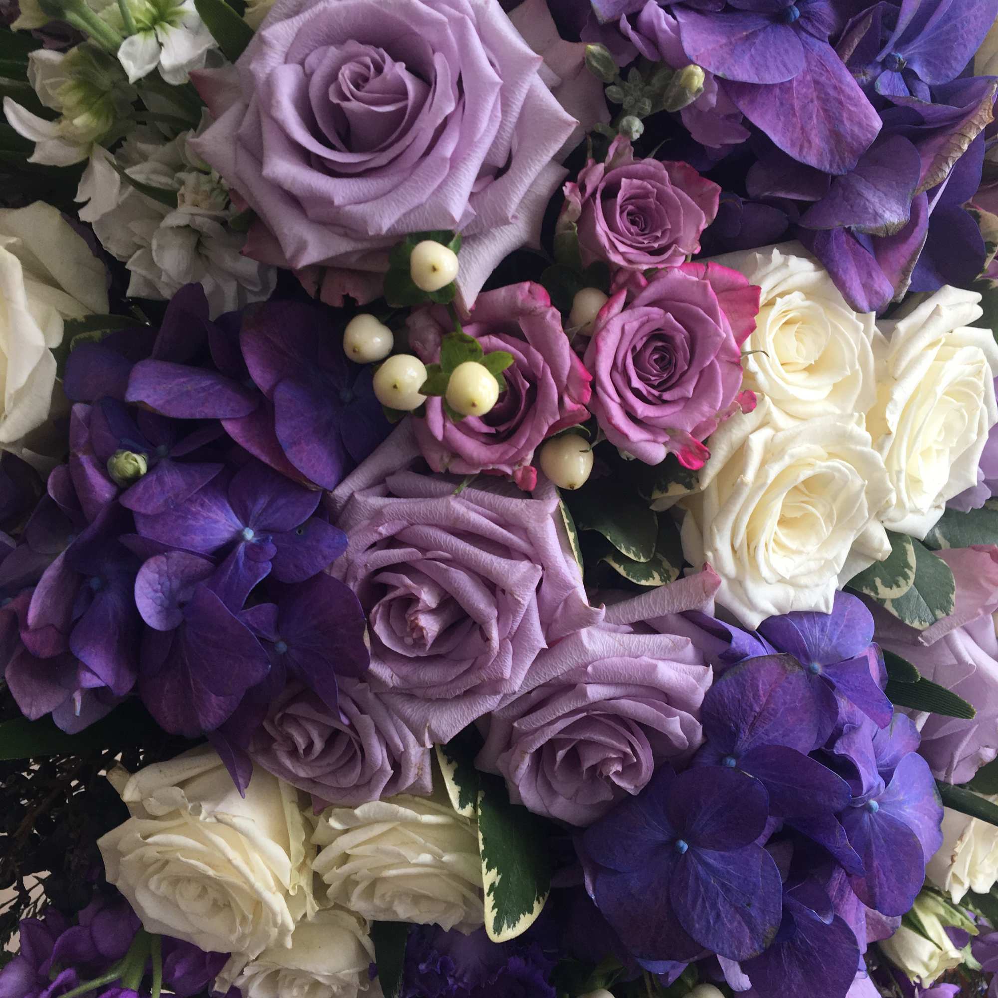 The Tranquility is a gorgeous, standing sympathy spray in shades of purple