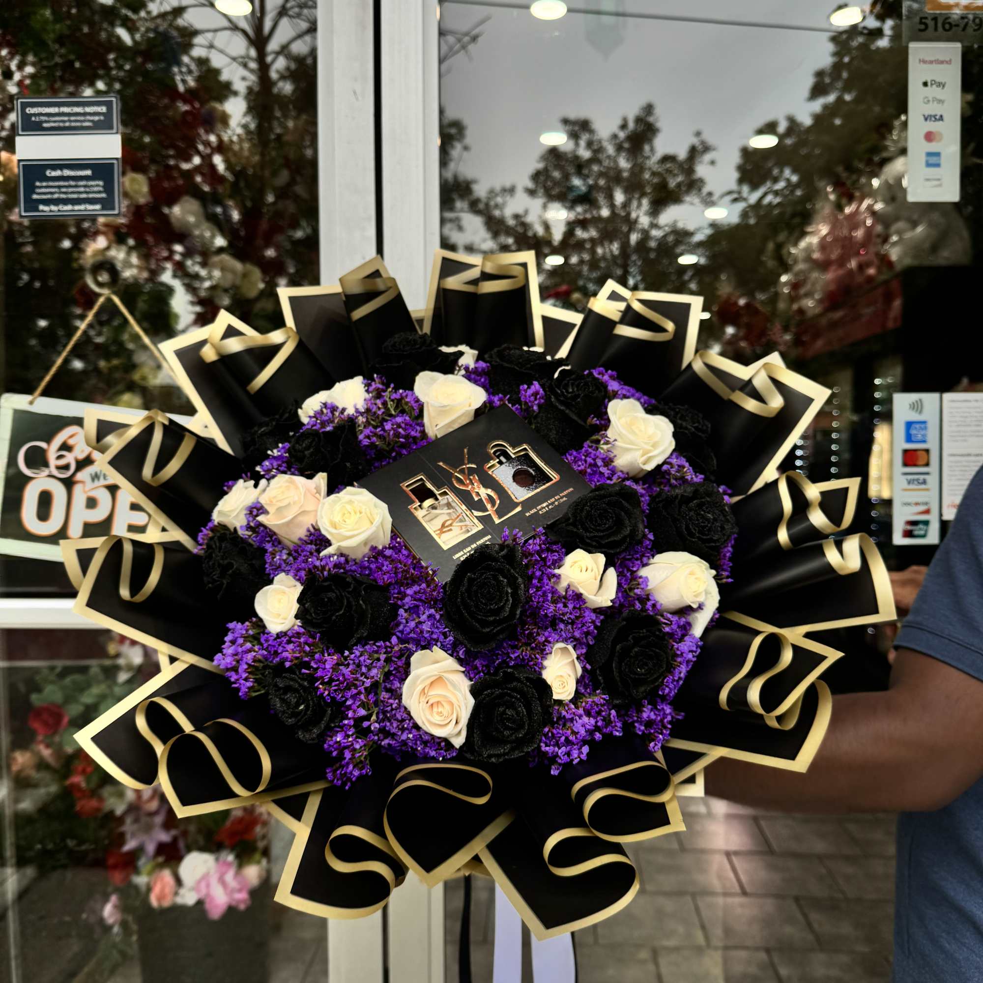 This exquisite bouquet features a dramatic black wrapping, which contrasts beautifully with