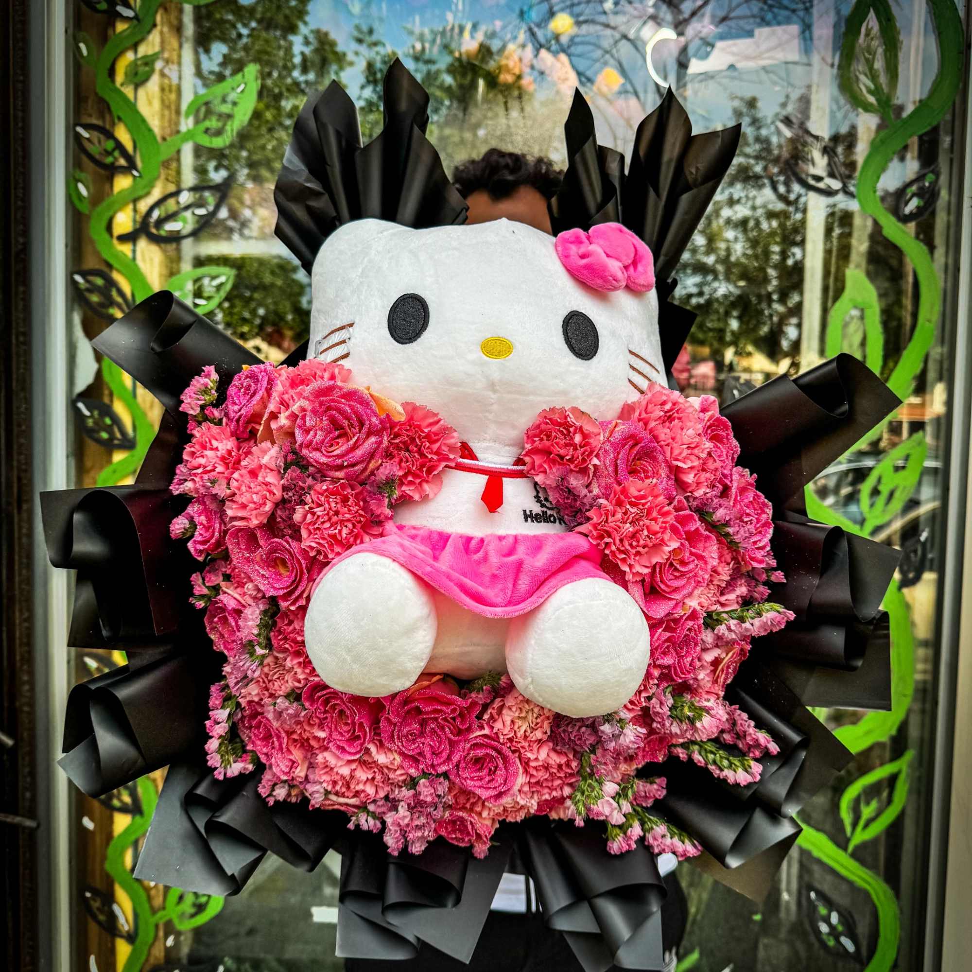 This charming bouquet combines soft blush pink and peach roses with a