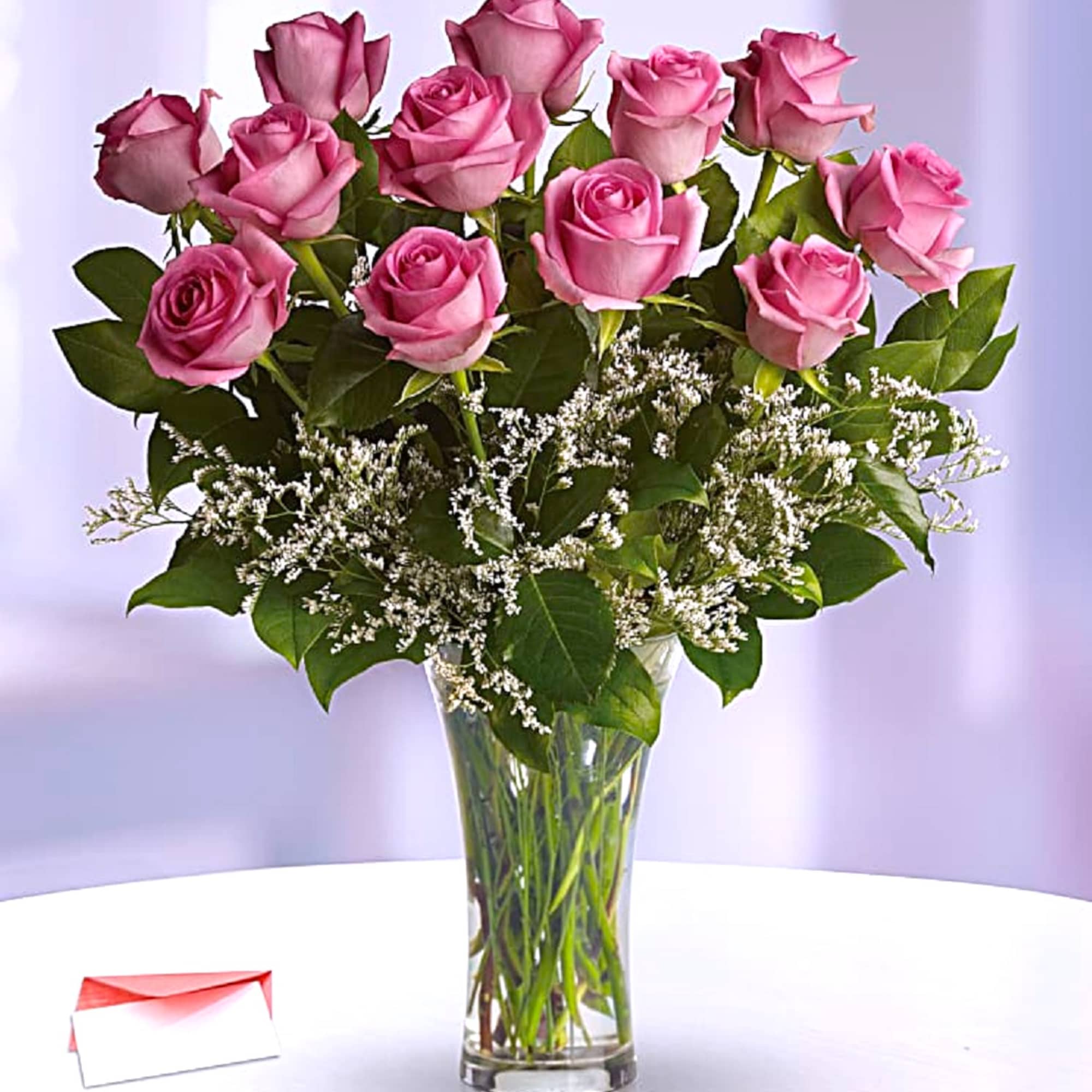 Blushing pink roses and delicate white Limonium add up to a feminine