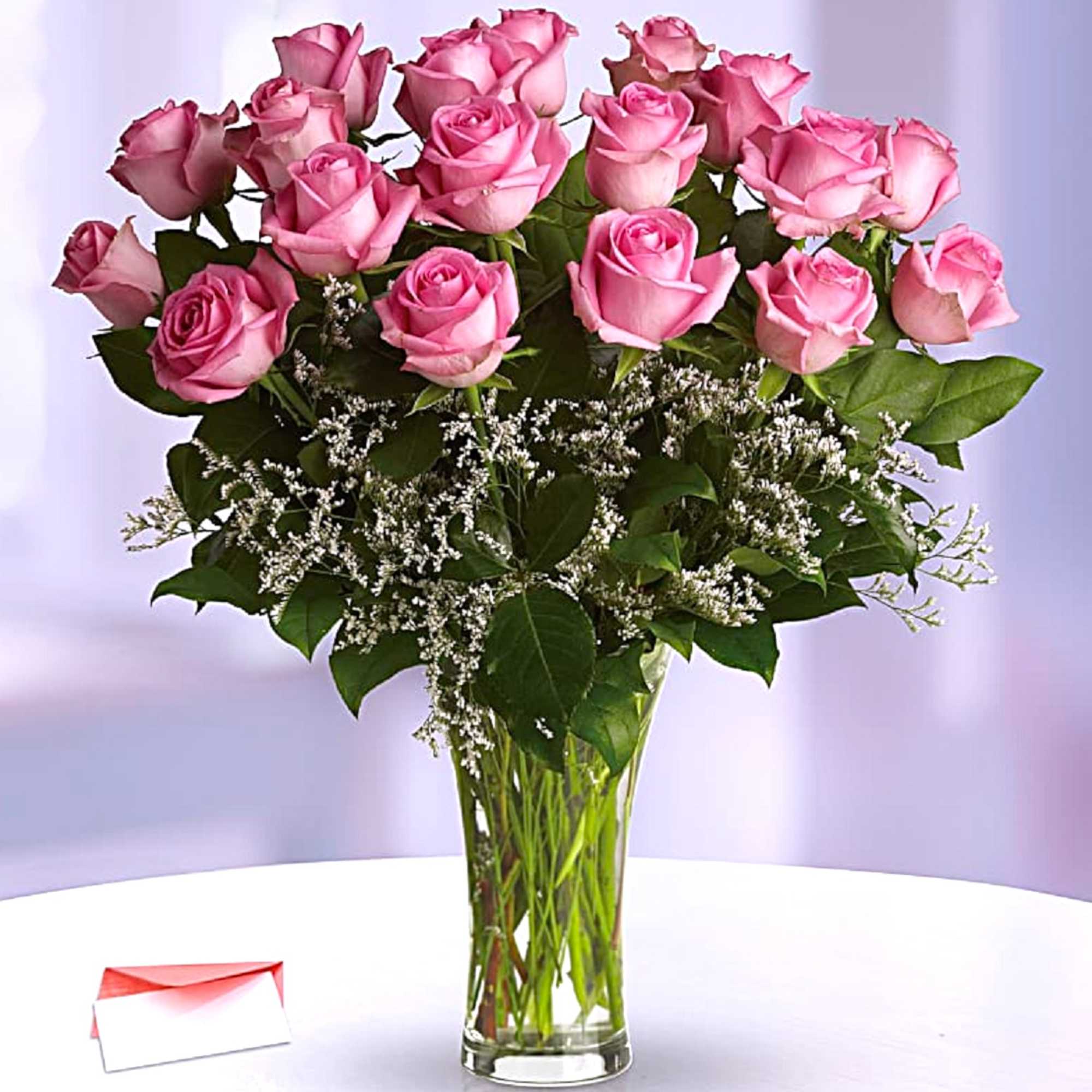 Blushing pink roses and delicate white Limonium add up to a feminine