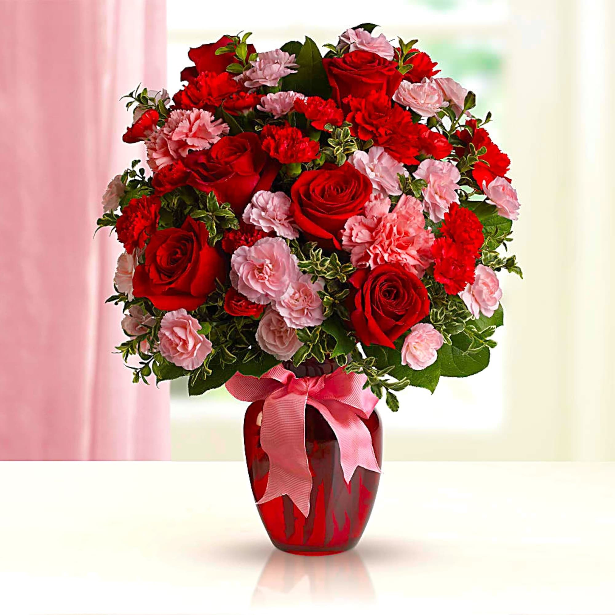 Fan the flames of love with this sizzling array of red roses