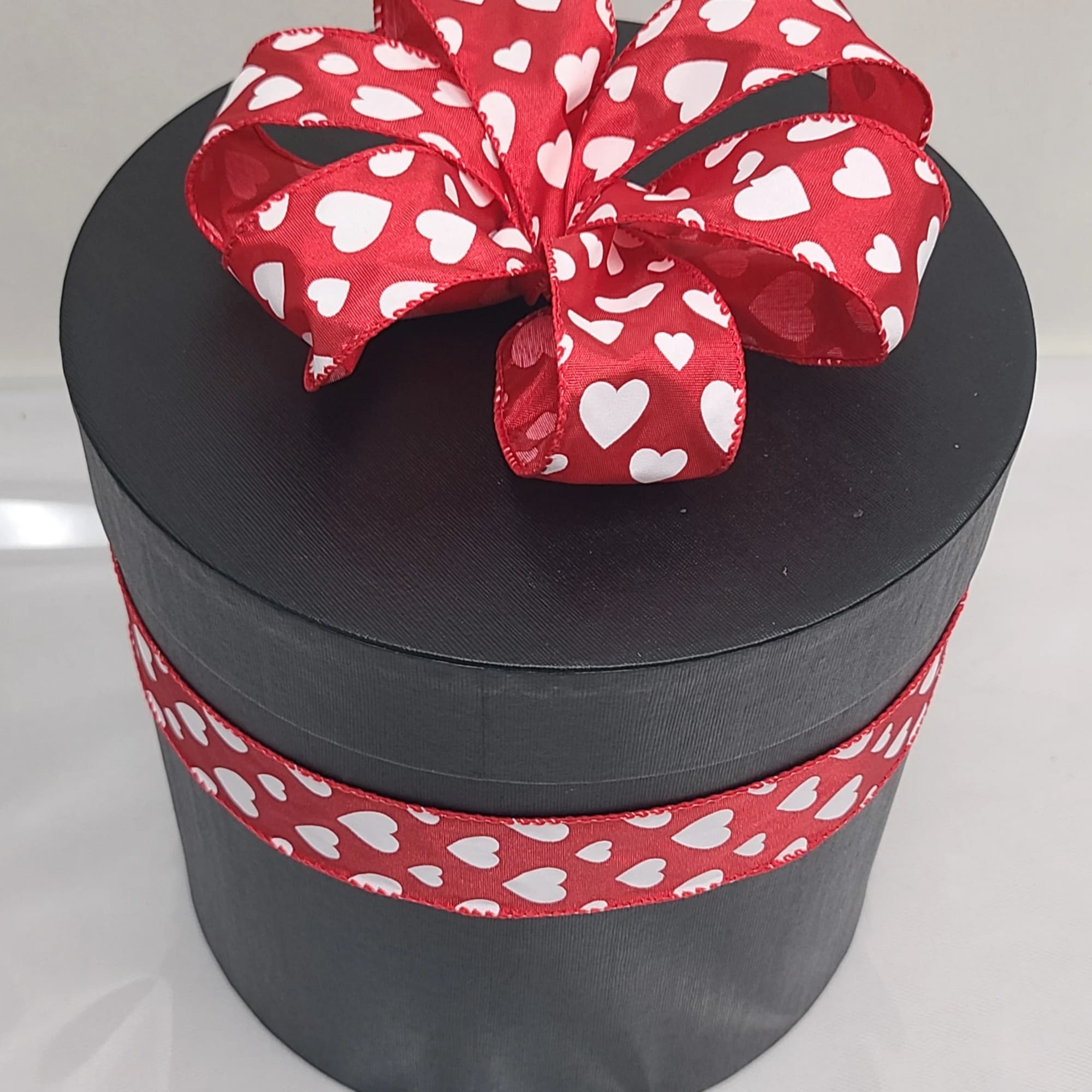 12 naturally preserved red roses accompanied by preserved baby&#039;s breath.