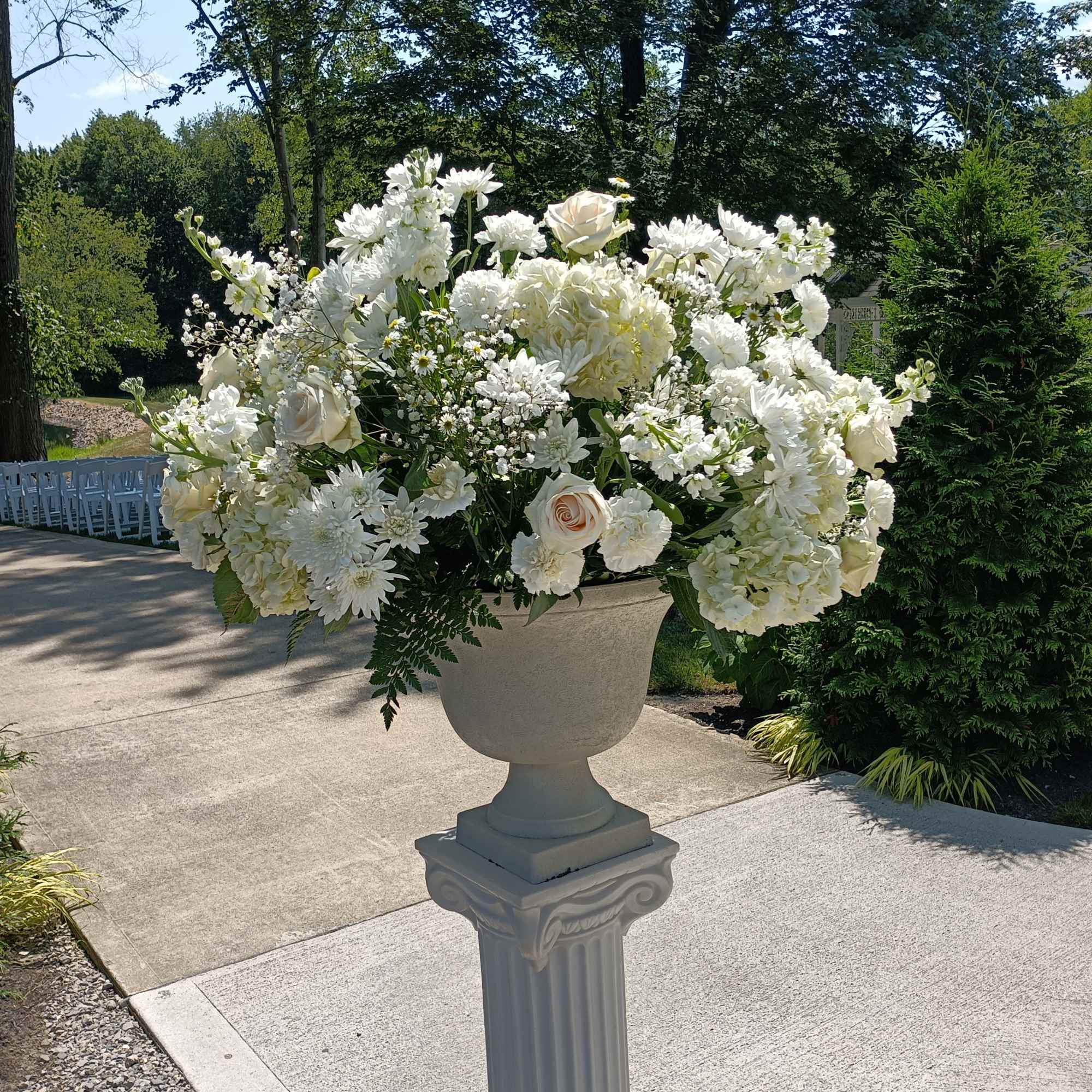 Beautiful white roses, hydrangeas, daisies, carnations, baby's breath and other filler flowers