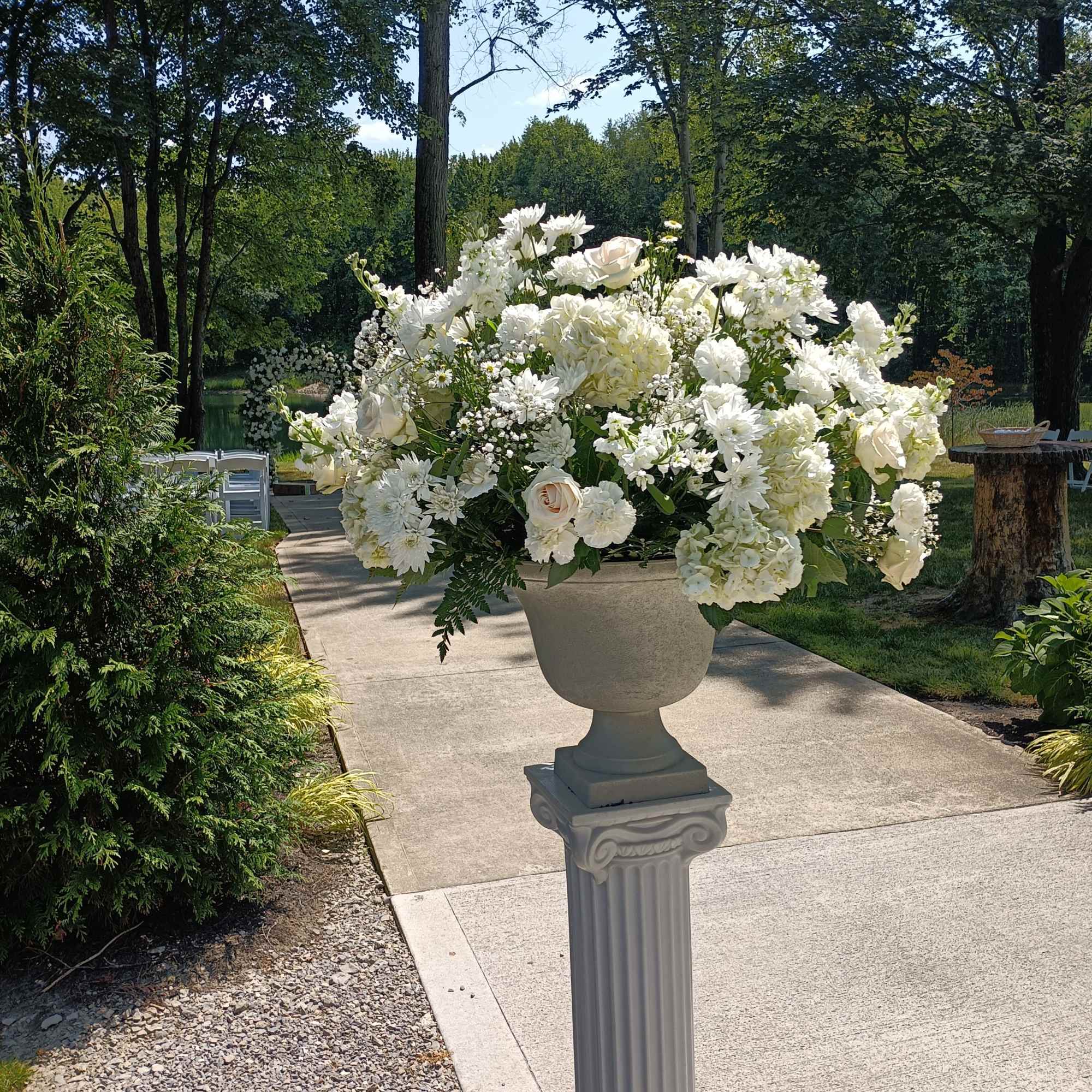Beautiful white roses, hydrangeas, daisies, carnations, baby's breath and other filler flowers