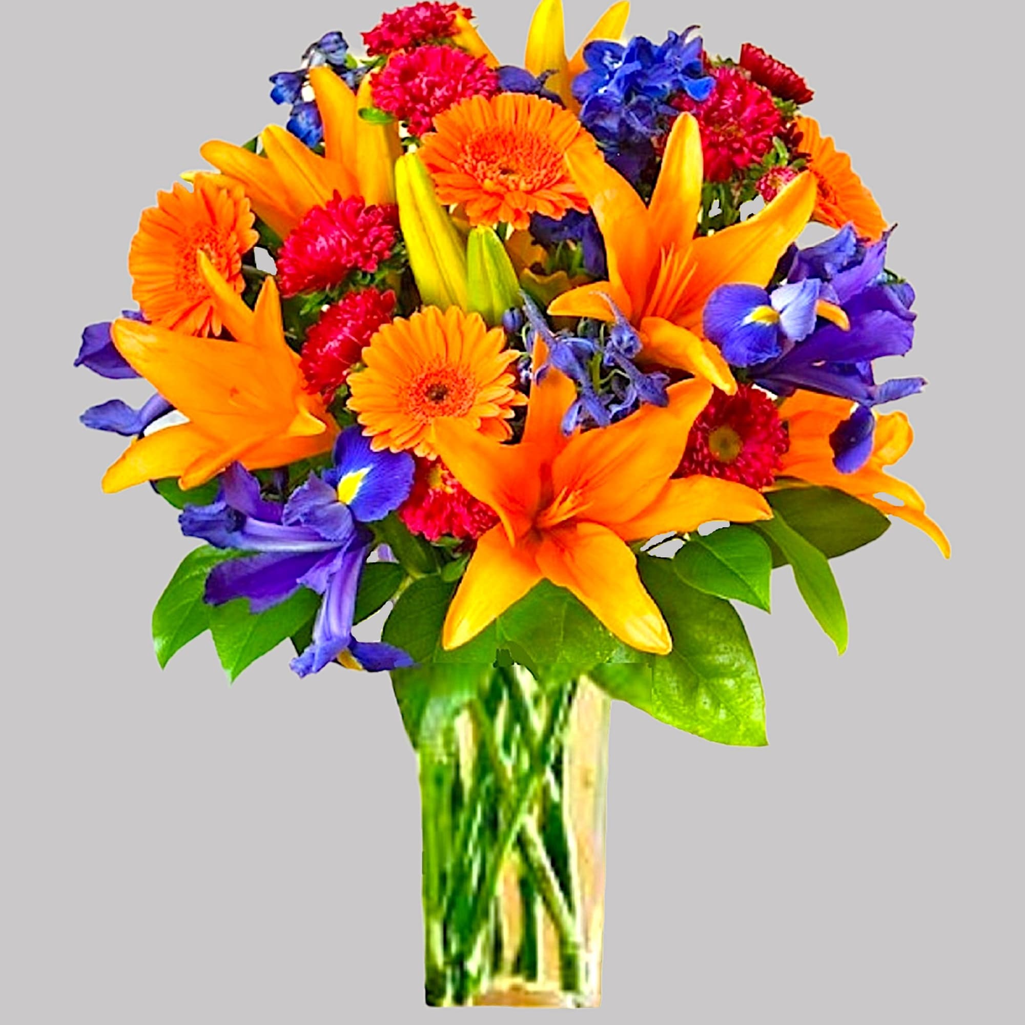 A perfectly pleasing mix of orange, red, and blue blossoms make this