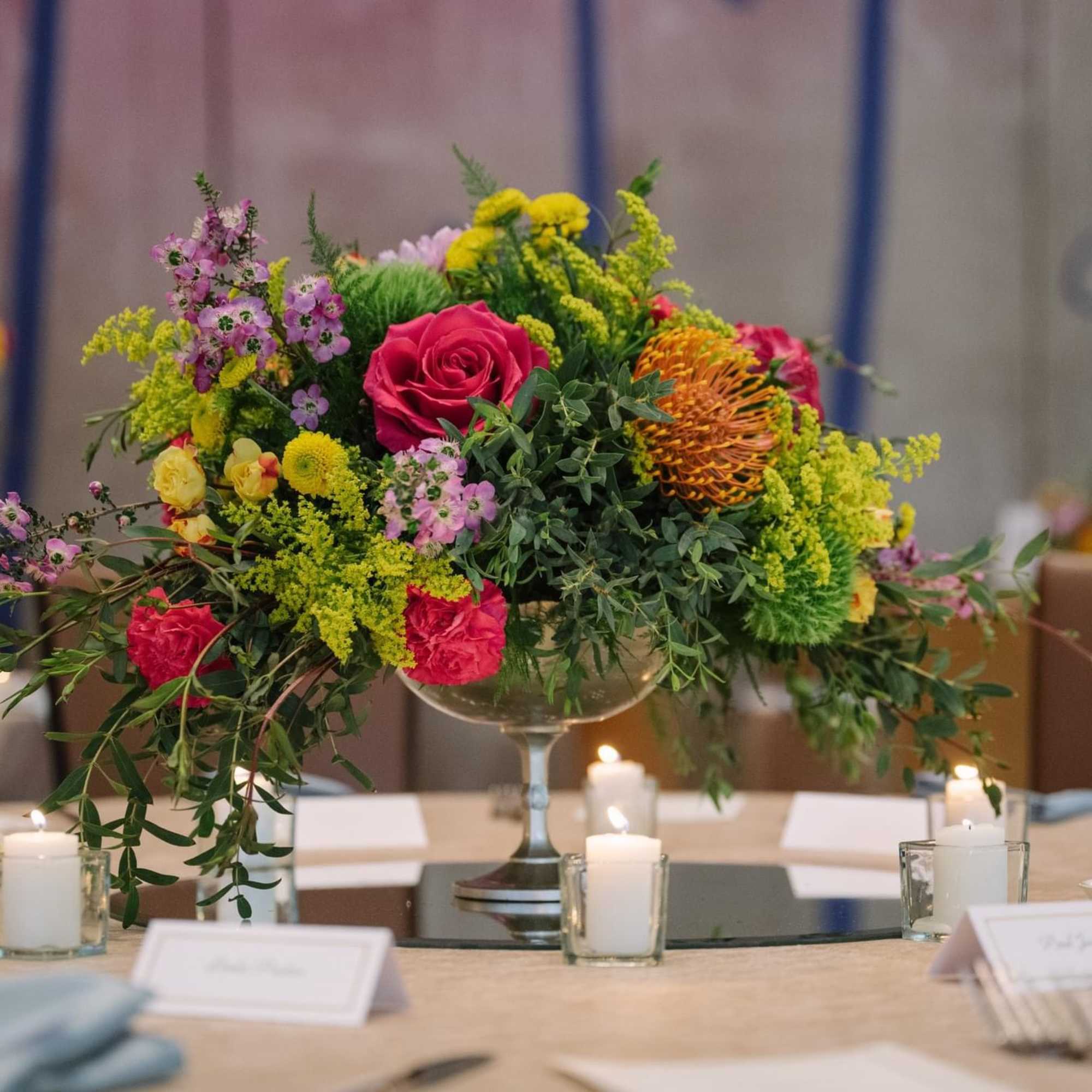 A striking blend of vibrant floral and lush greenery. A striking blend of vibrant floral and lush greenery.