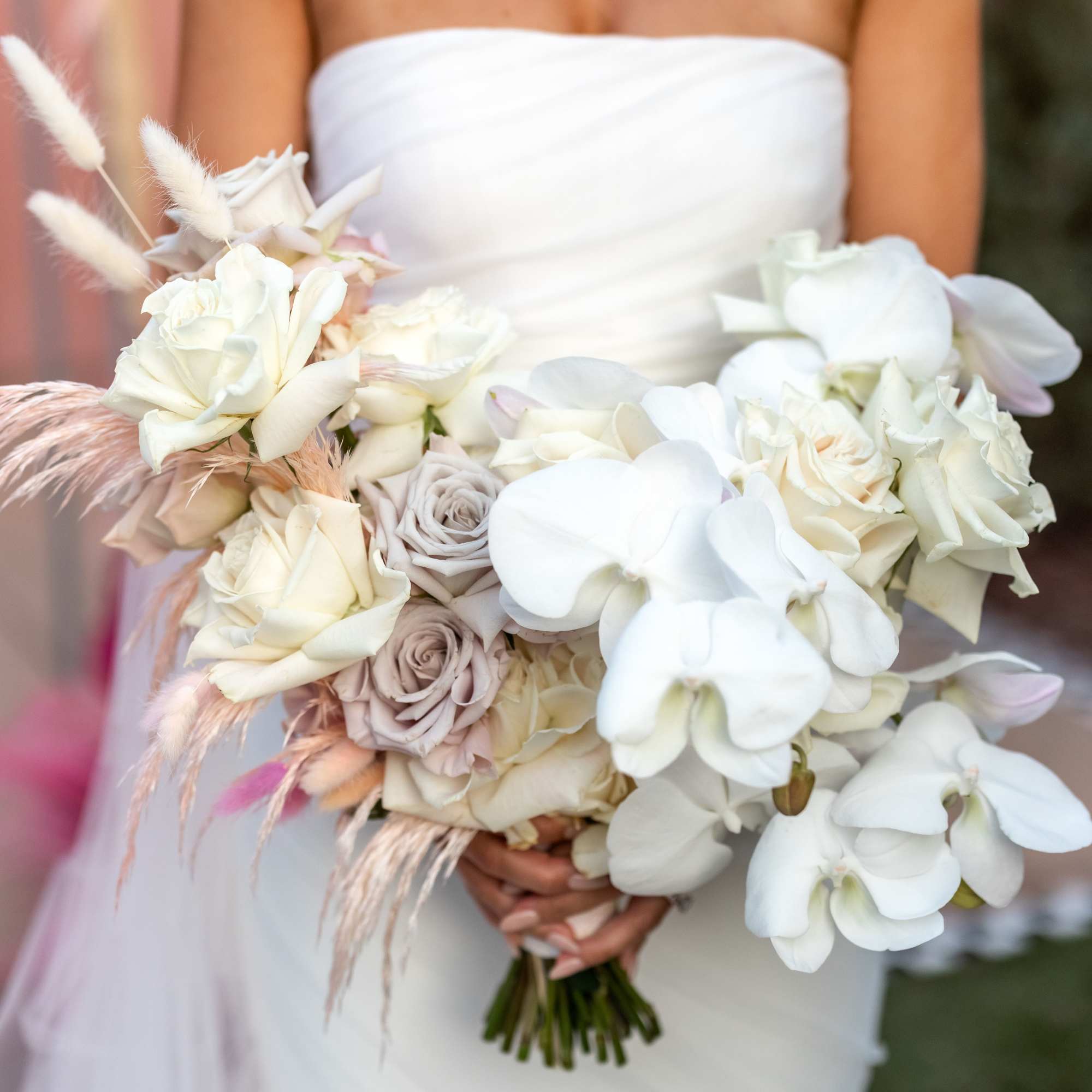 - Elegant white orchids paired with delicate pale pink and purple-toned accent