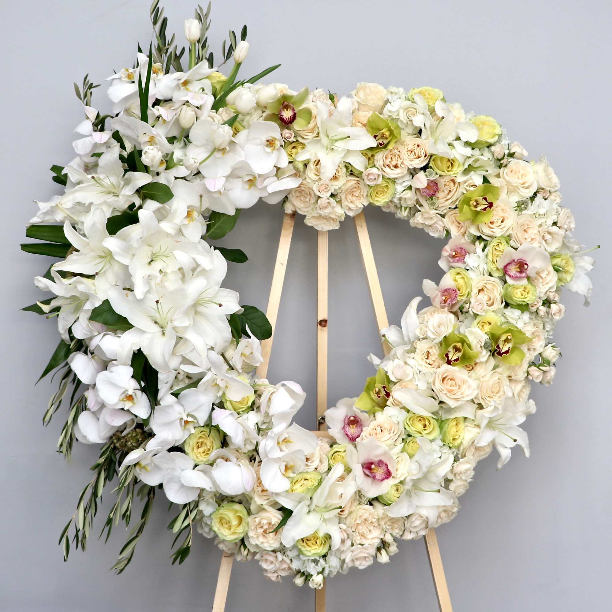 Arranged on a base of roses and hydrangeas, this heart also contains