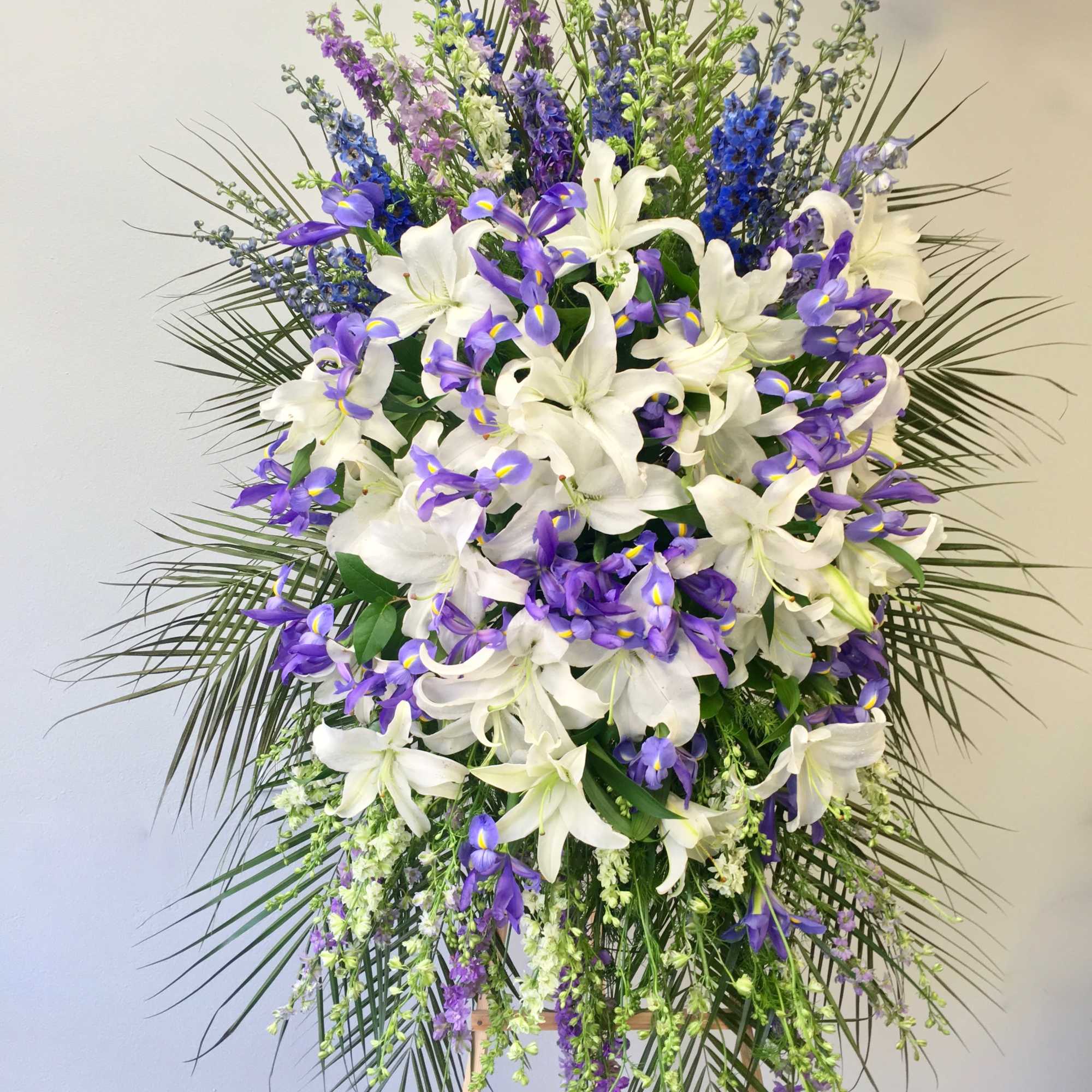 This spray includes a mix of lavender and purple florals, as well