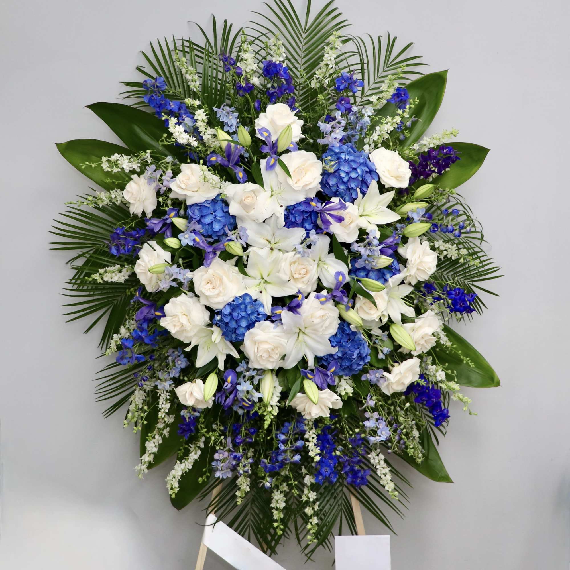 This spray includes a mix of lavender and purple florals, as well