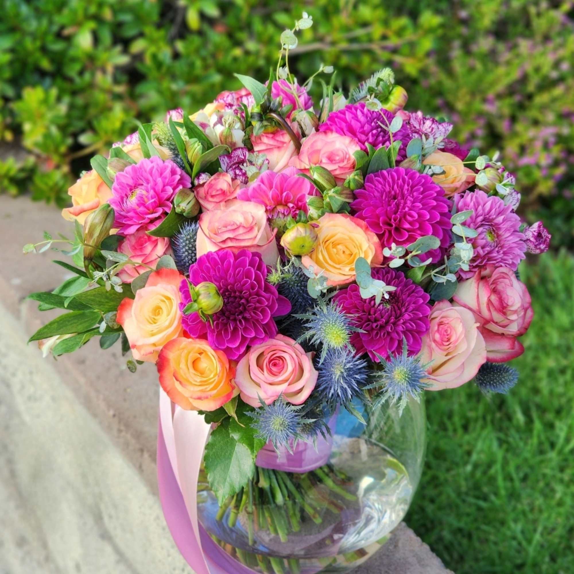 Lavender shades paired with light spray roses and dahlias create a harmonious