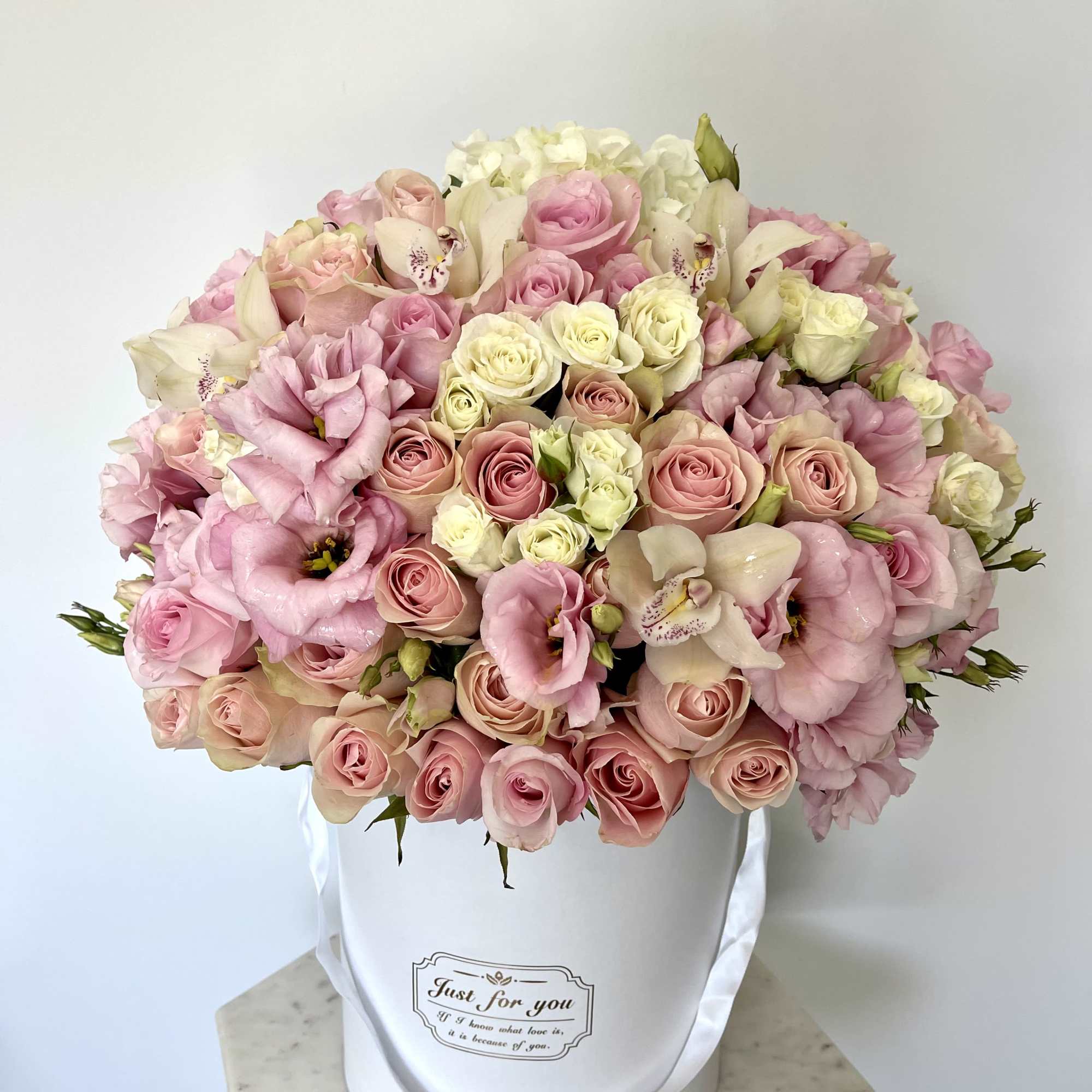 This beautiful box contains a combination of fresh roses, hydrangeas and lisianthus