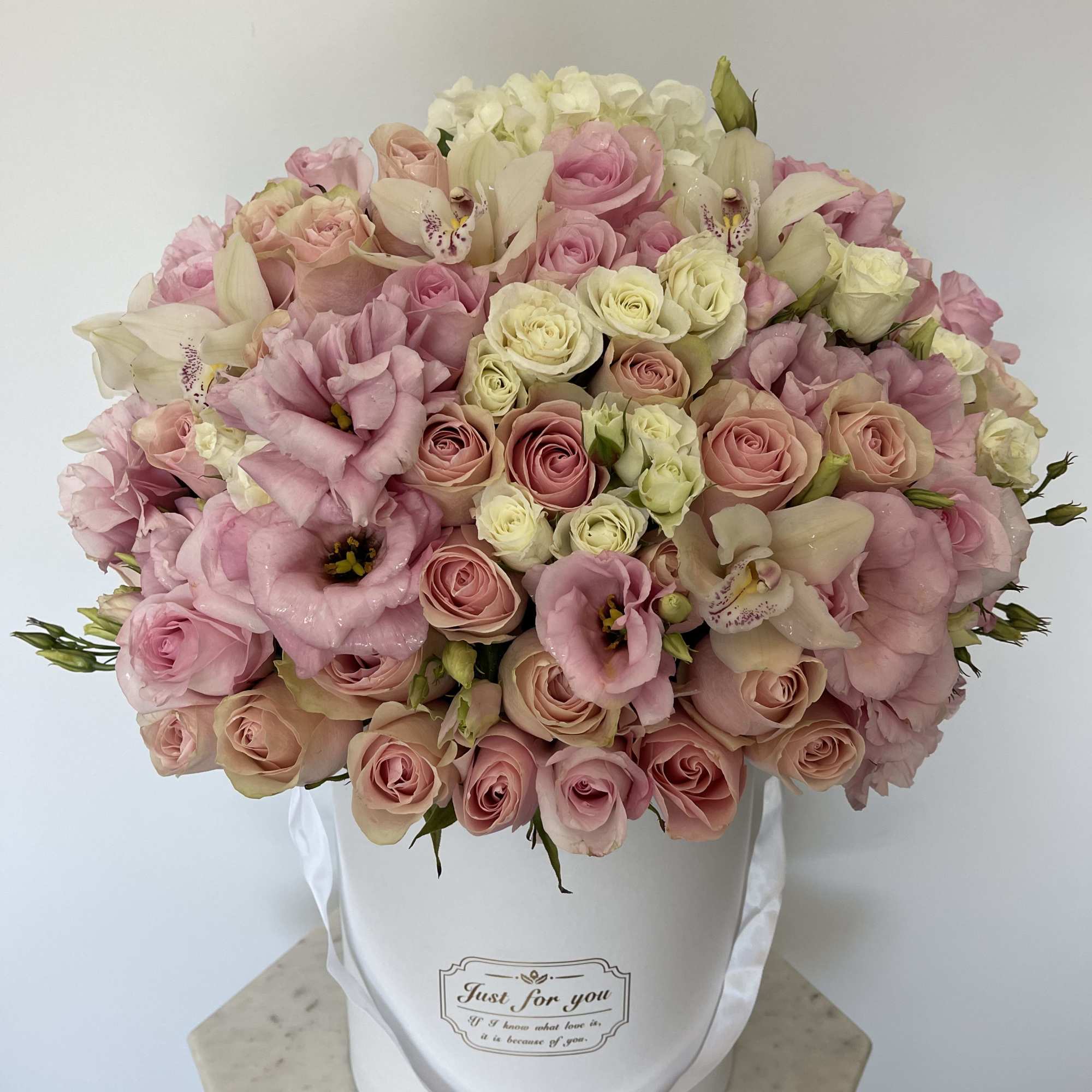 This beautiful box contains a combination of fresh roses, hydrangeas and lisianthus