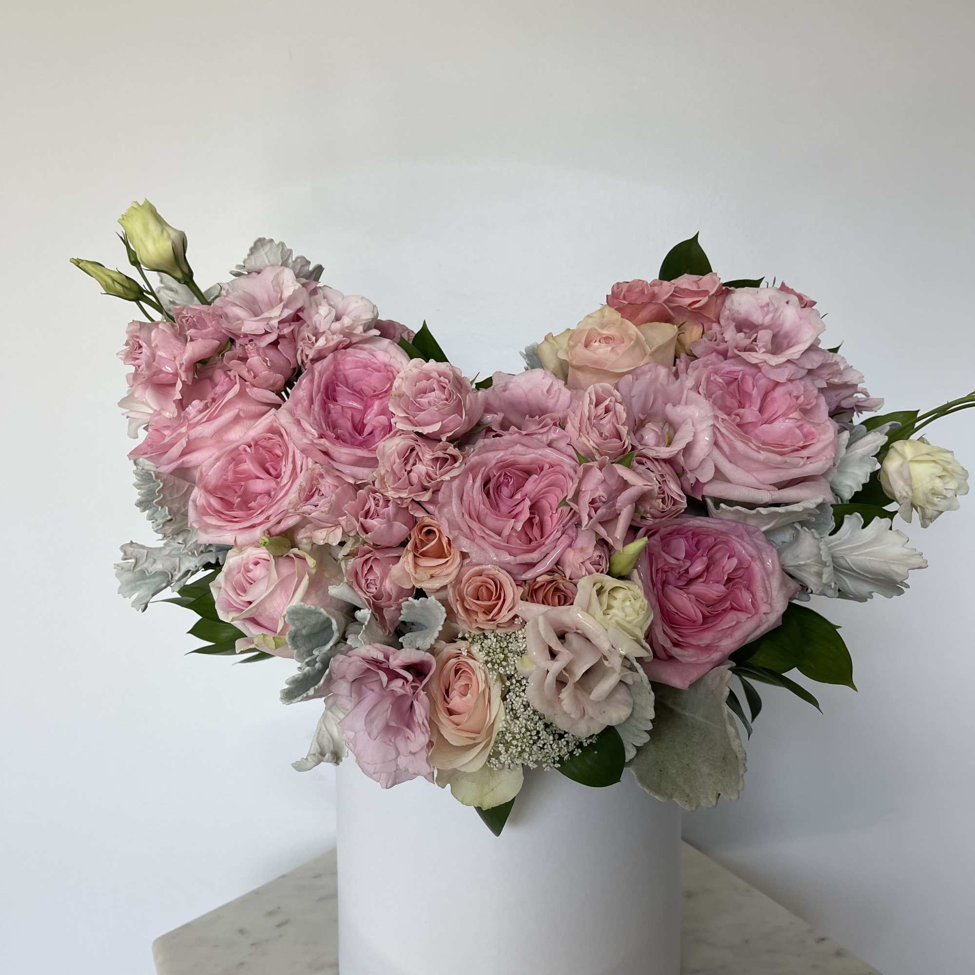 This beautiful box contains a combination fresh roses, hydrangeas, spray roses and
