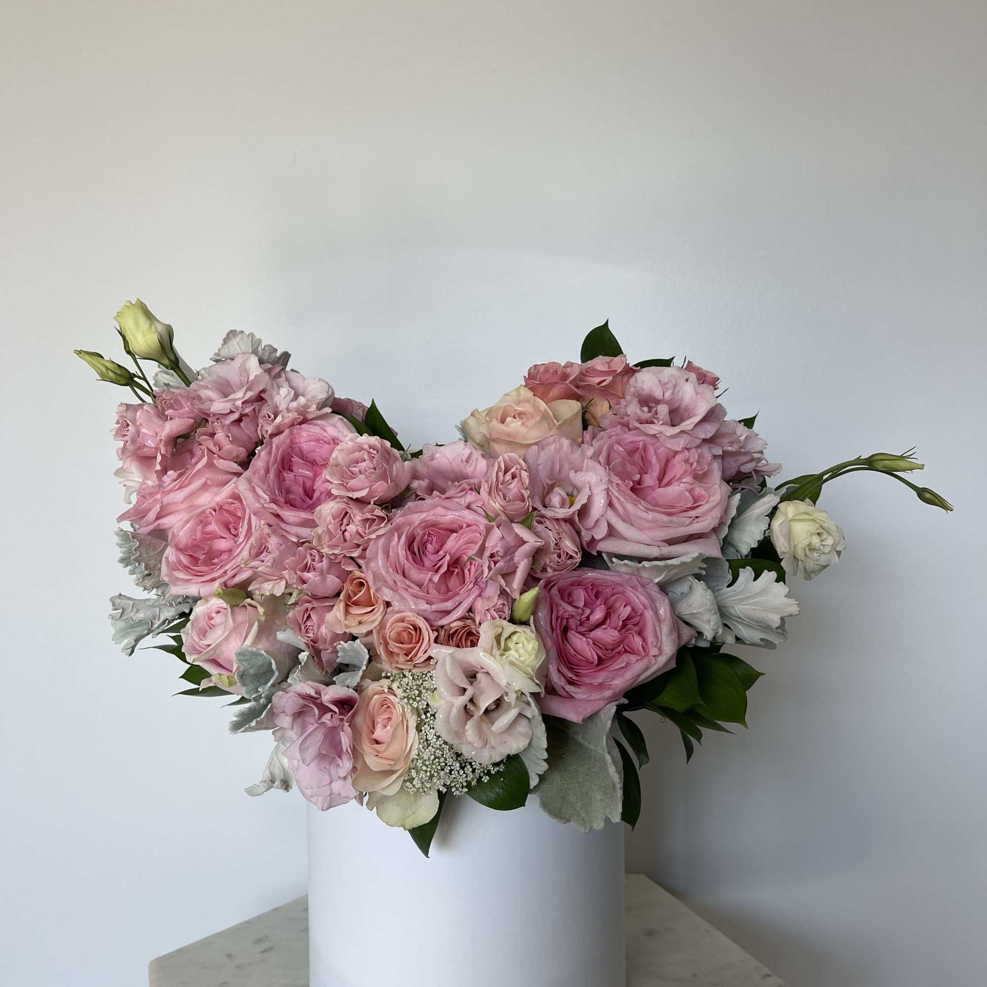 This beautiful box contains a combination fresh roses, hydrangeas, spray roses and