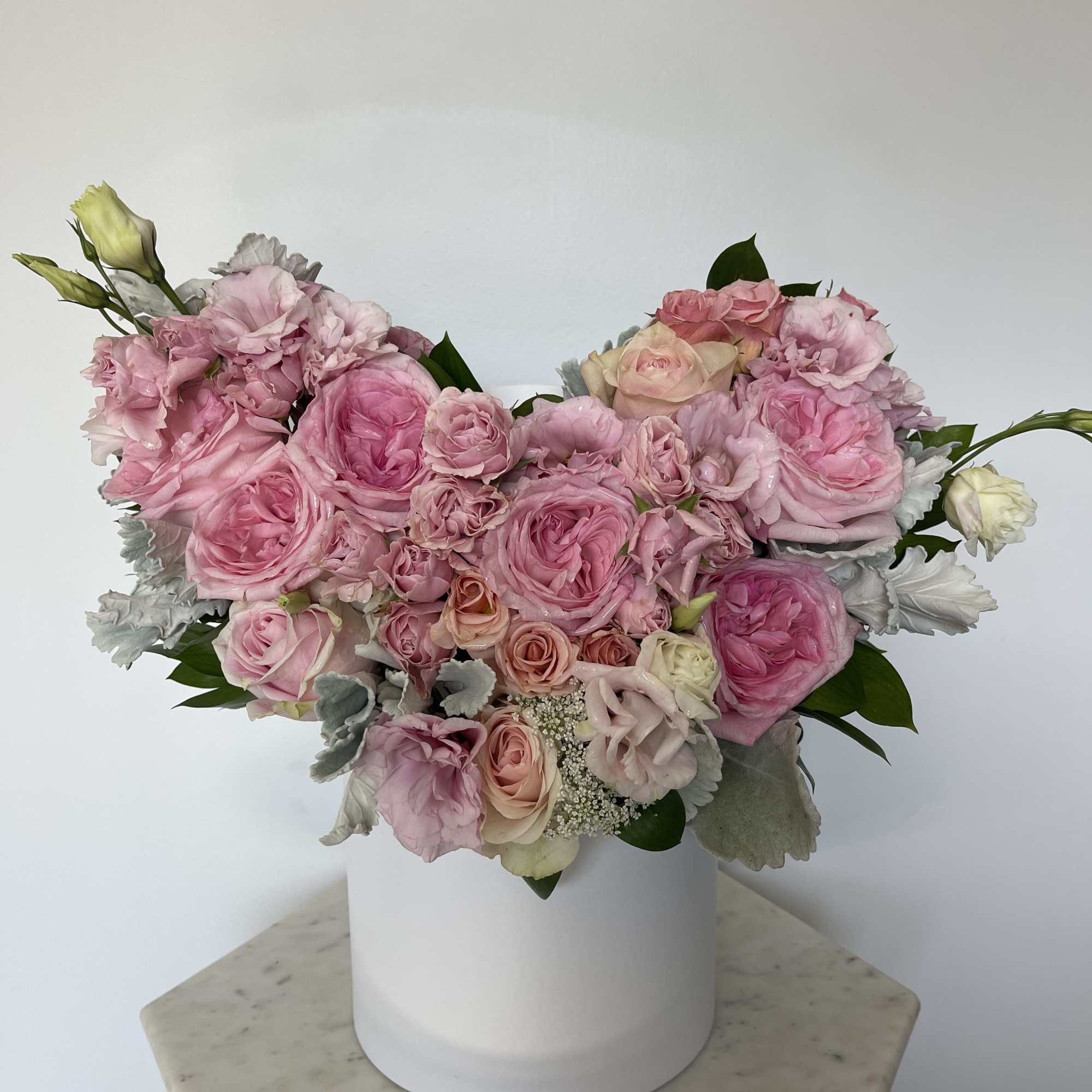 This beautiful box contains a combination fresh roses, hydrangeas, spray roses and