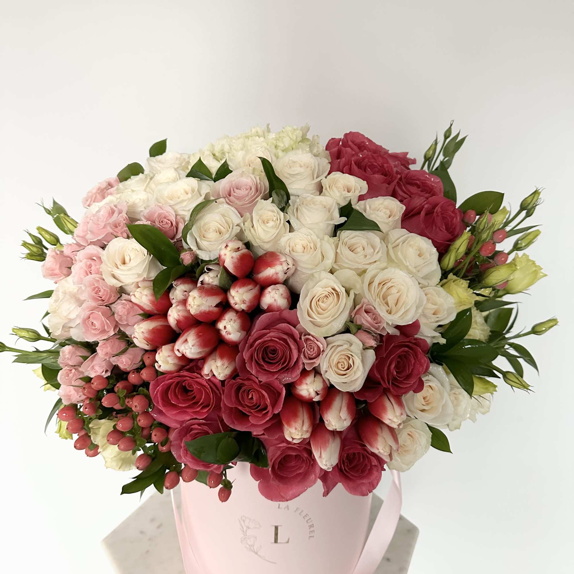 This beautiful arrangement filled with the roses, tulips, hydrangeas and greens to