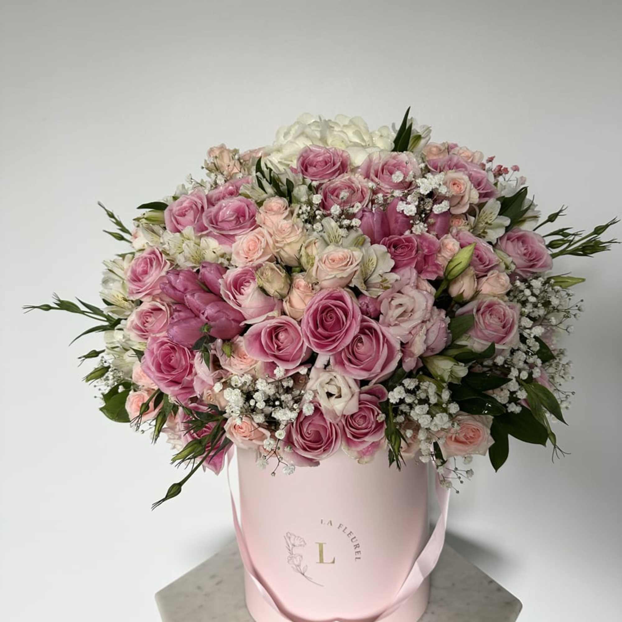 This beautiful arrangement filled with the roses, spray roses, hydrangeas and greens