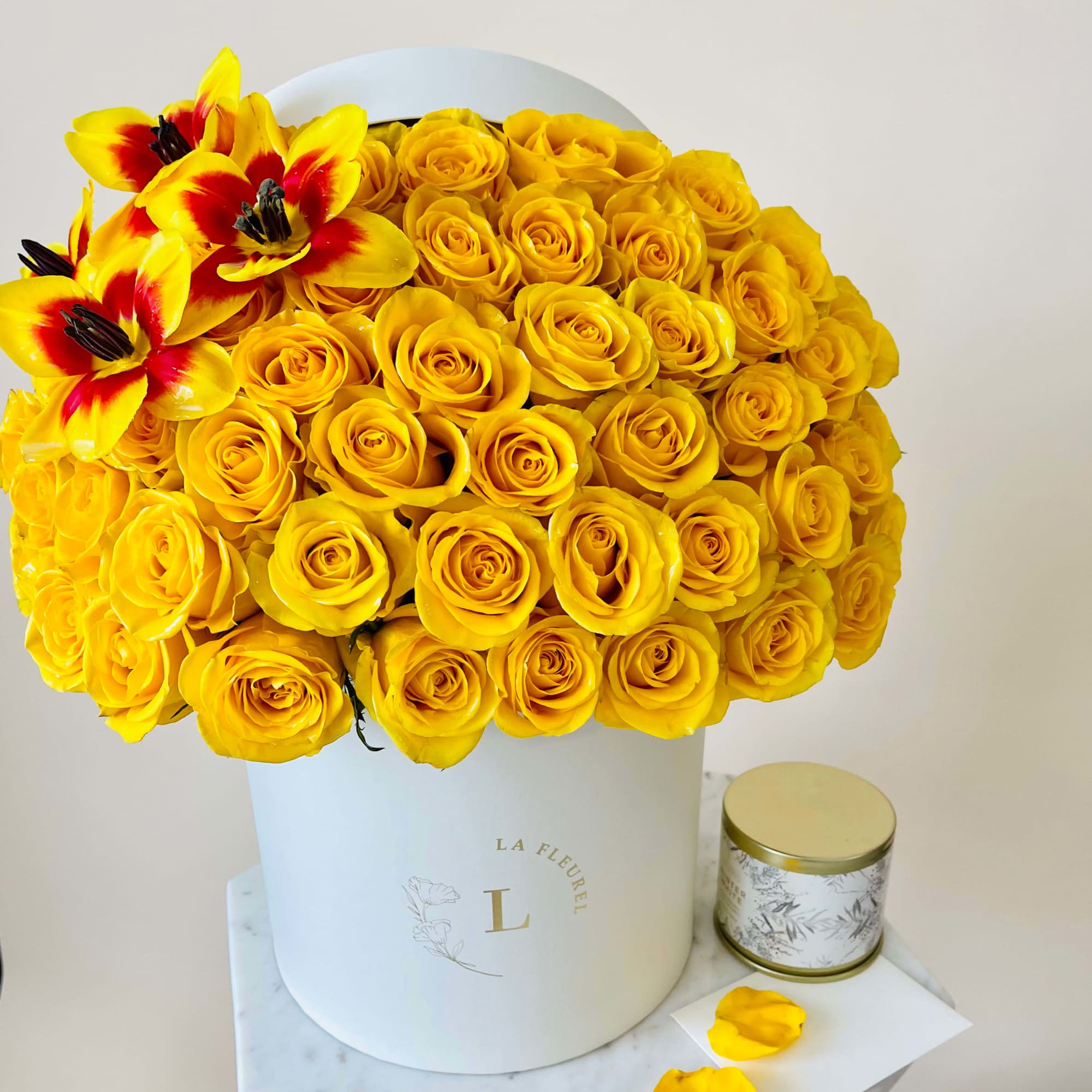 Yellow and glory in this composition are presented with roses and tulips.