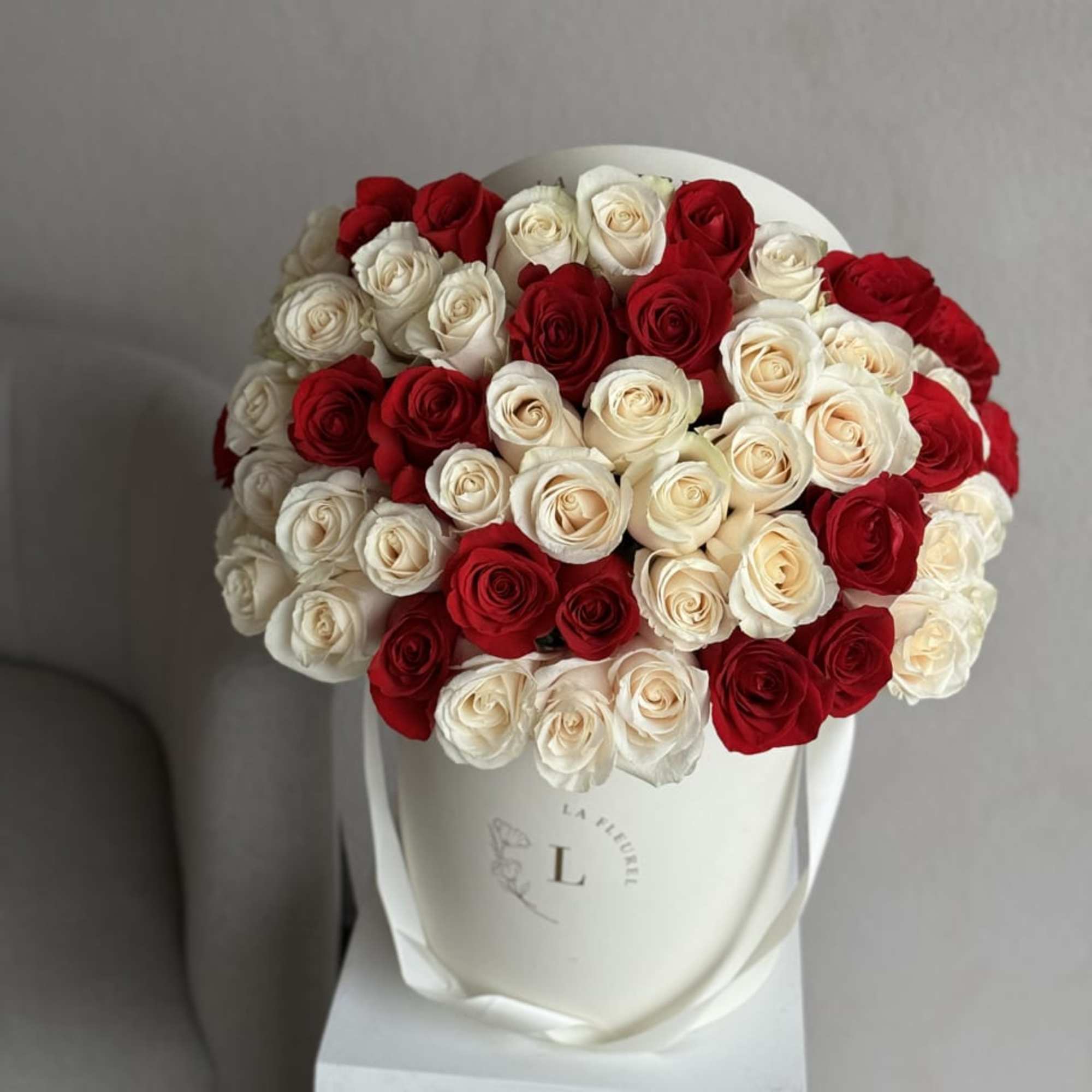 This beautiful arrangement filled with the white and red roses to deliver