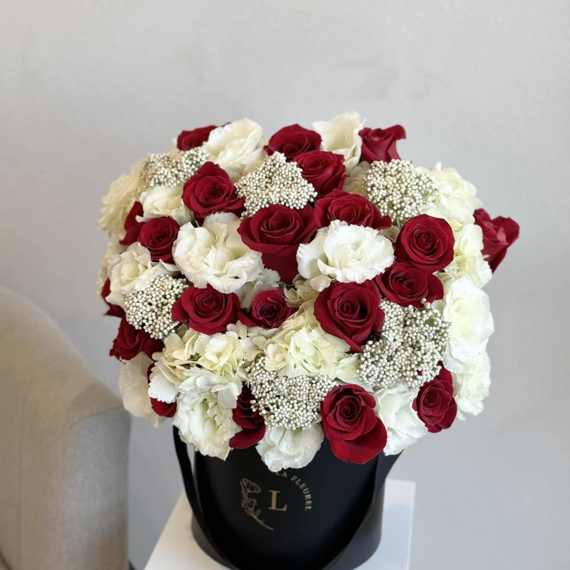 Experience the timeless allure of our &#039;Red and White Radiance&#039; bouquet. This