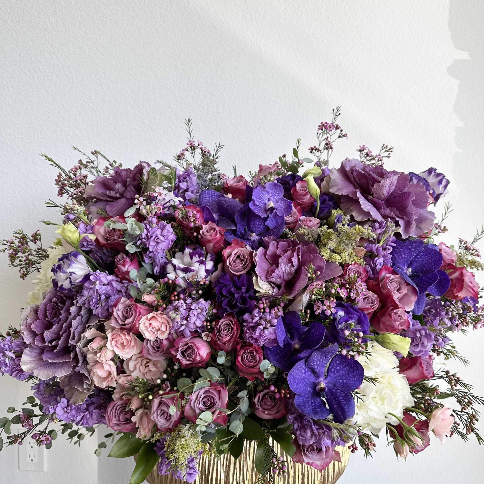 This beautiful arrangement filled with the roses and orchids to deliver your