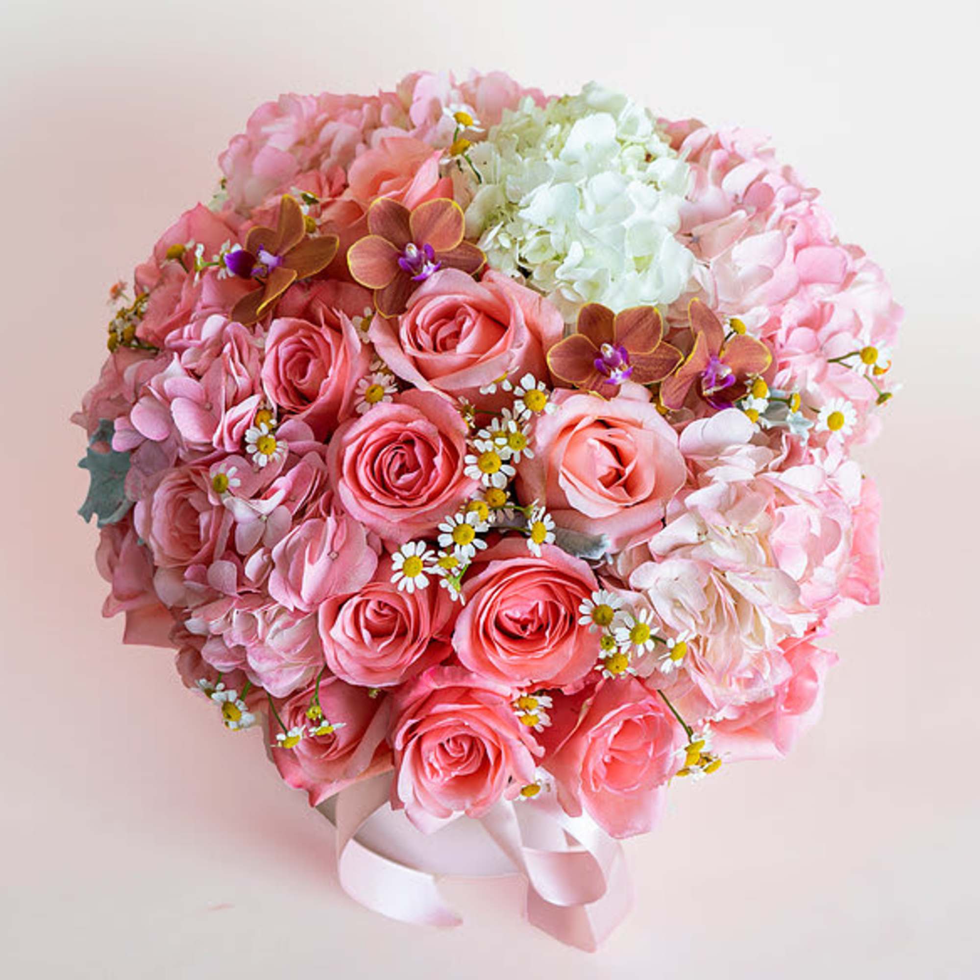 This beautiful arrangement filled with the roses, hydrangeas and chamomiles to deliver